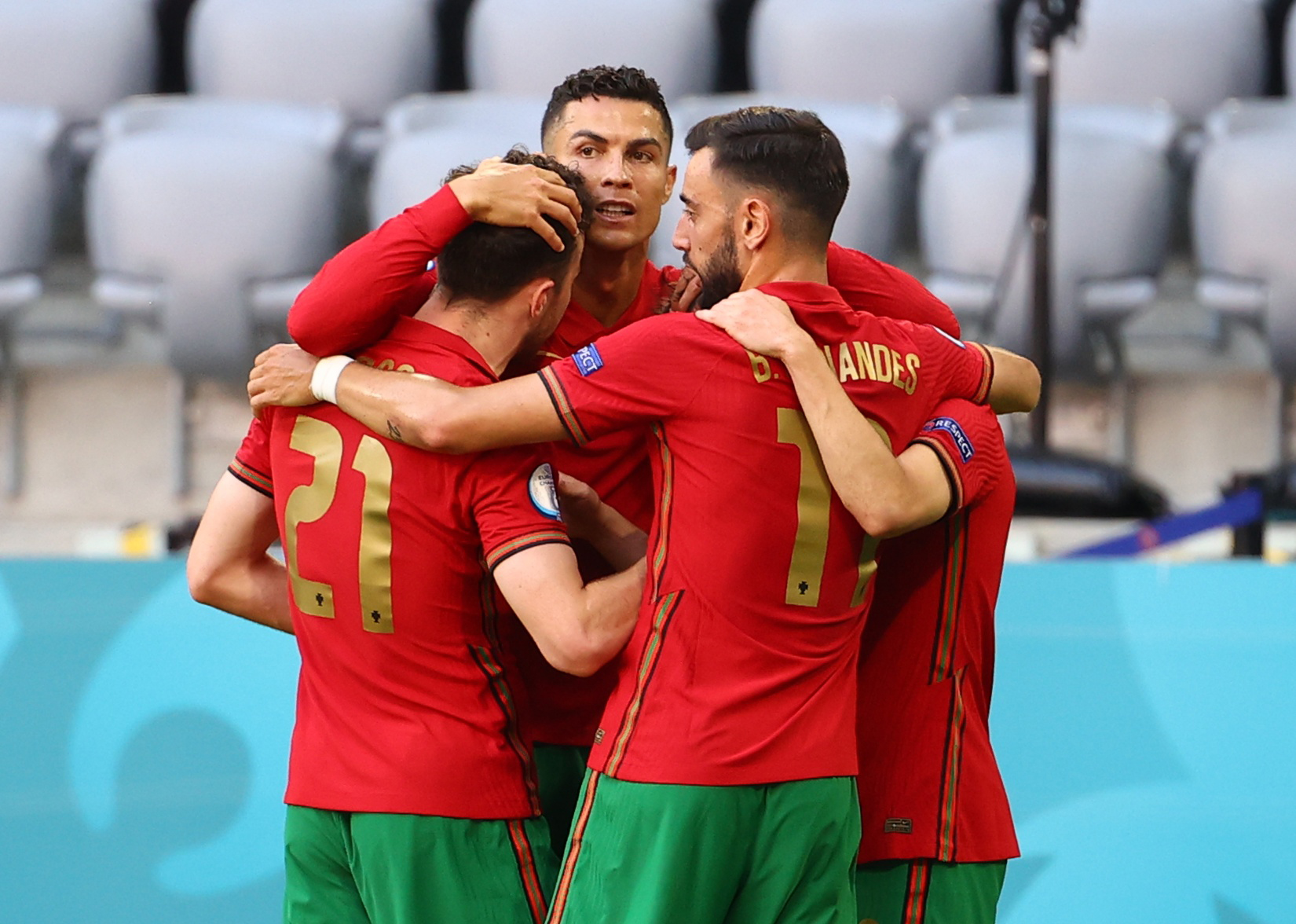 Soccer Football - Euro 2020 - Group F - Portugal v Germany - Football Arena Munich, Munich, Germany - June 19, 2021 Portugal's Cristiano Ronaldo celebrates scoring their first goal with teammates Pool via REUTERS