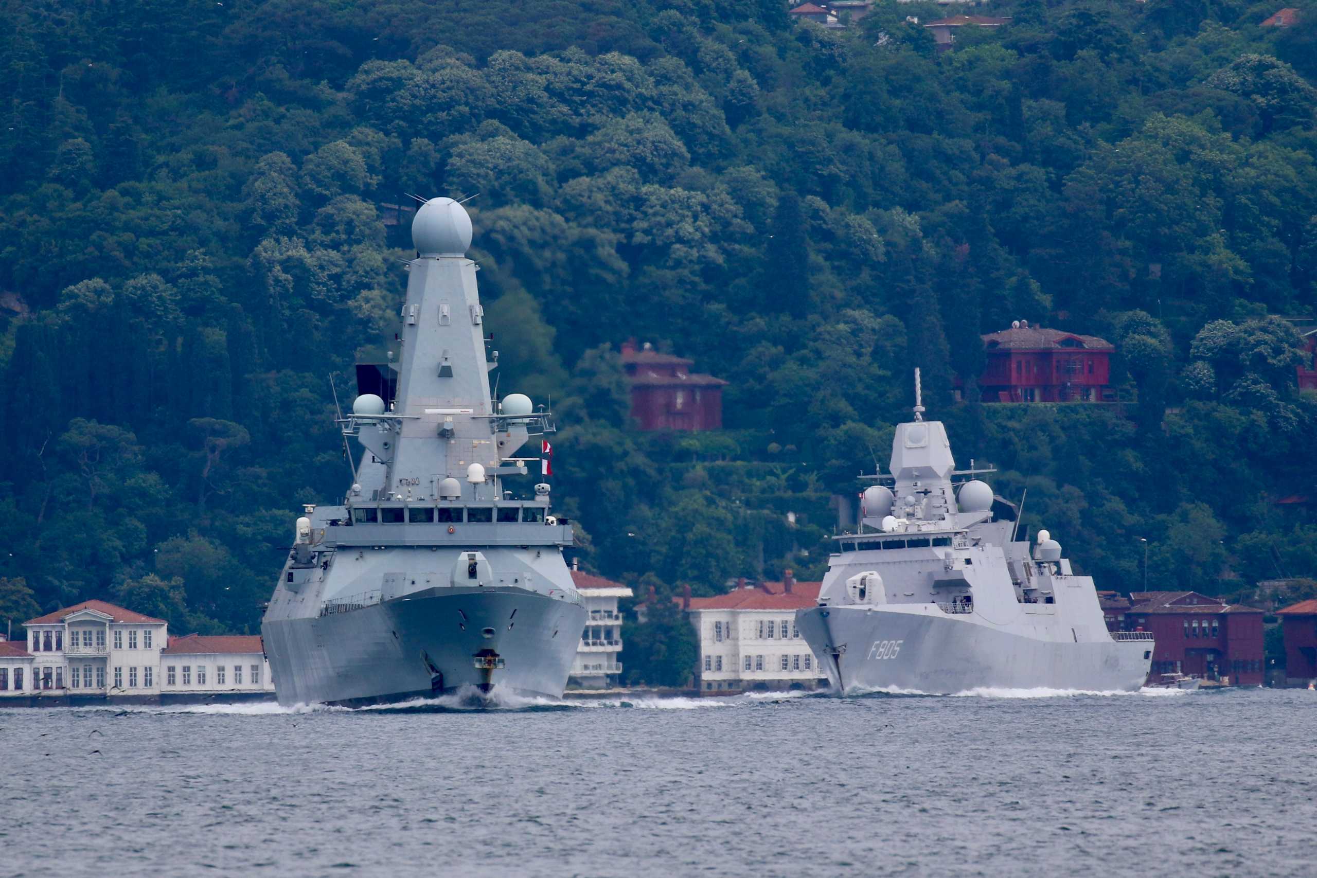 FILE PHOTO: Royal Navy's Type 45 destroyer HMS Defender, followed by Royal Netherlands Navy frigate HNLMS Evertsen, sets sail in the Bosphorus, on its way to the Black Sea, in Istanbul, Turkey June 14, 2021. REUTERS