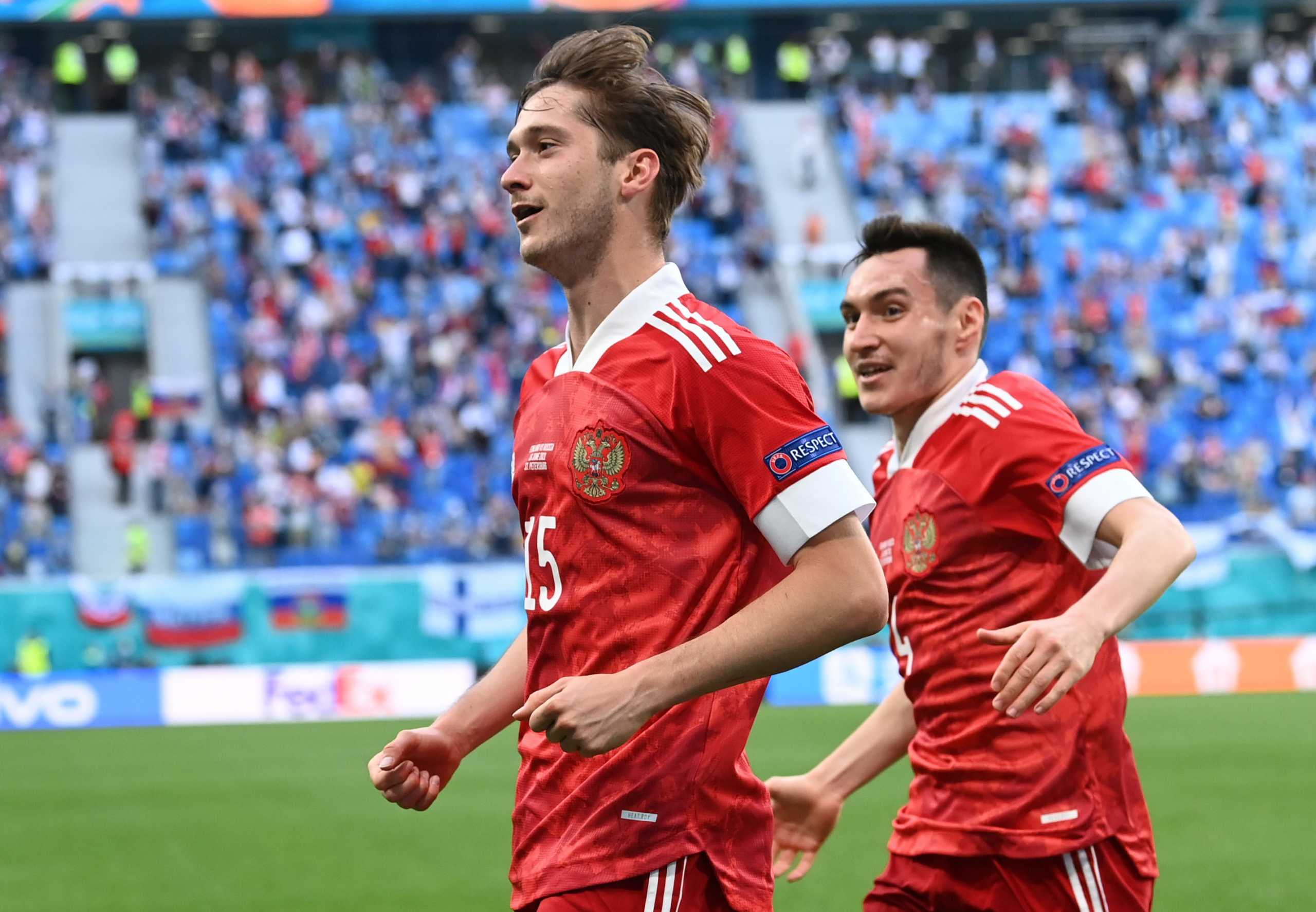 Soccer Football - Euro 2020 - Group B - Finland v Russia - Saint Petersburg Arena, Saint Petersburg, Russia - June 16, 2021 Russia's Aleksei Miranchuk celebrates scoring their first goal with Vyacheslav Karavayev Pool via REUTERS