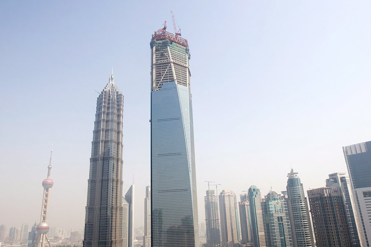 epa01008243 The Shanghai World Financial Center under construction in Luiiazui, the financial district in Shanghai, China 14 May 2007. The Financial Center which is being developed by Japanese real-estate tycoon Minoru Mori will be one of the world's tallest buildings when it is completed. It will have 101 stories and stand 492 meters tall. In addition to offices the tower will contain the world's highest observation platform, a five star hotel, shopping facilities and a conference center.  EPA