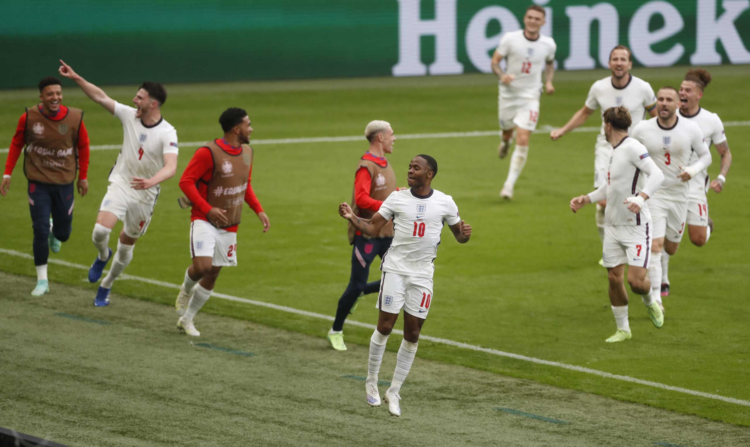 Soccer Football - Euro 2020 - Round of 16 - England v Germany - Wembley Stadium, London, Britain - June 29, 2021 England's Raheem Sterling celebrates scoring their first goal with teammates Pool via REUTERS