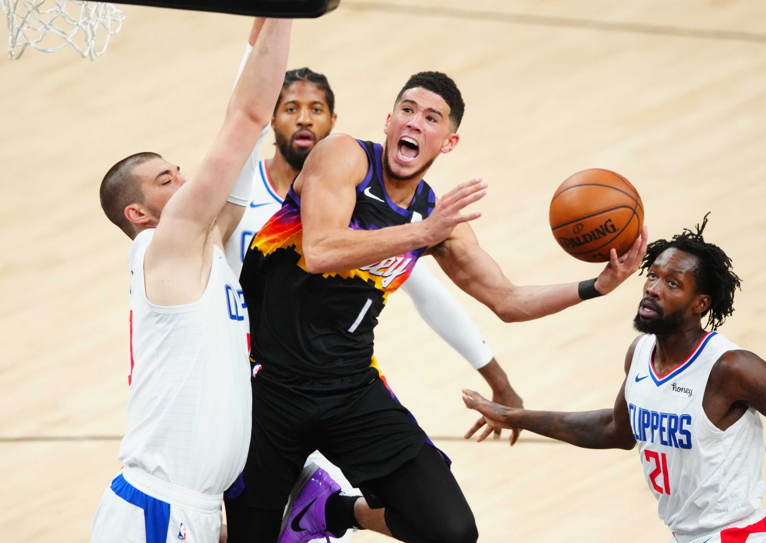 Jun 20, 2021; Phoenix, Arizona, USA; Phoenix Suns guard Devin Booker (1) drives to the basket against the Los Angeles Clippers in the first half during game one of the Western Conference Finals for the 2021 NBA Playoffs at Phoenix Suns Arena. Mandatory Credit: Mark J. Rebilas-USA TODAY Sports