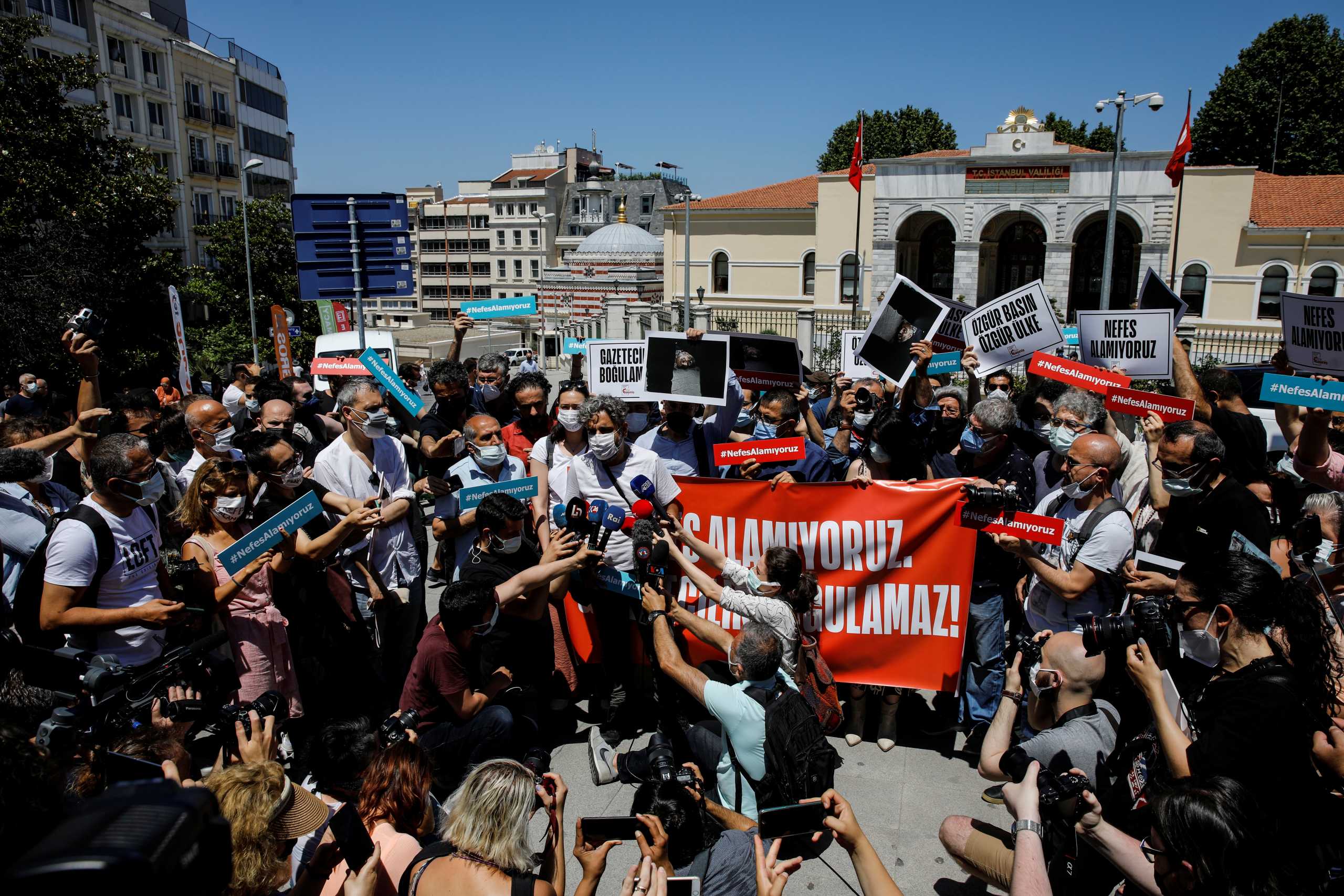 In response to photographer Bulent Kilic being taken into police custody for covering June 26th's banned pride parade, media workers gather in protest of the pressure on free speech and journalism in Istanbul, Turkey, June 29, 2021. Banner reads, "We can't breathe. Journalism will not be suffocated". REUTERS