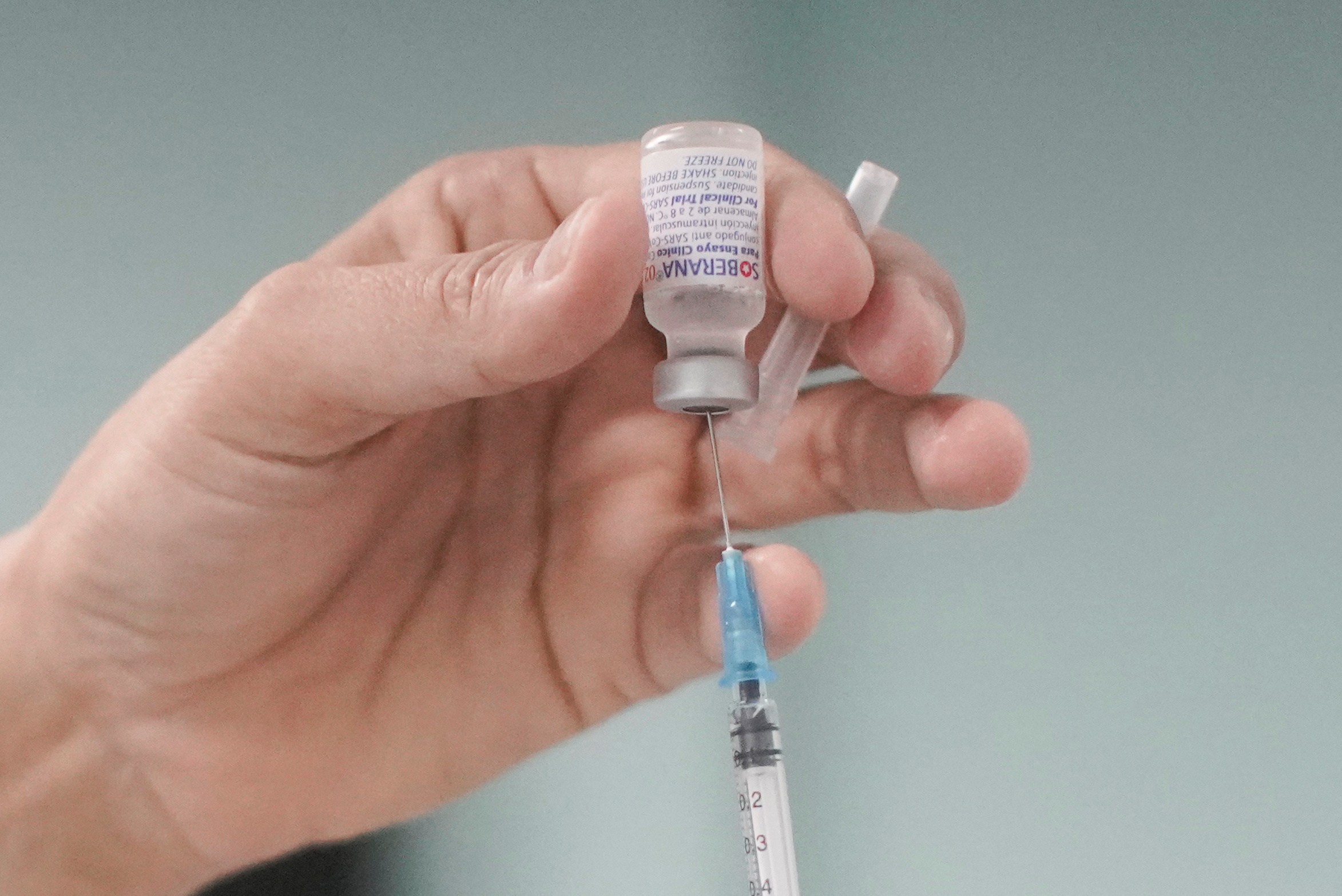 A nurse prepares a dose of the Soberana 02 vaccine during its clinical trials at a hospital amid concerns about the spread of the coronavirus disease (COVID-19) in Havana, Cuba, June 29, 2021. REUTERS
