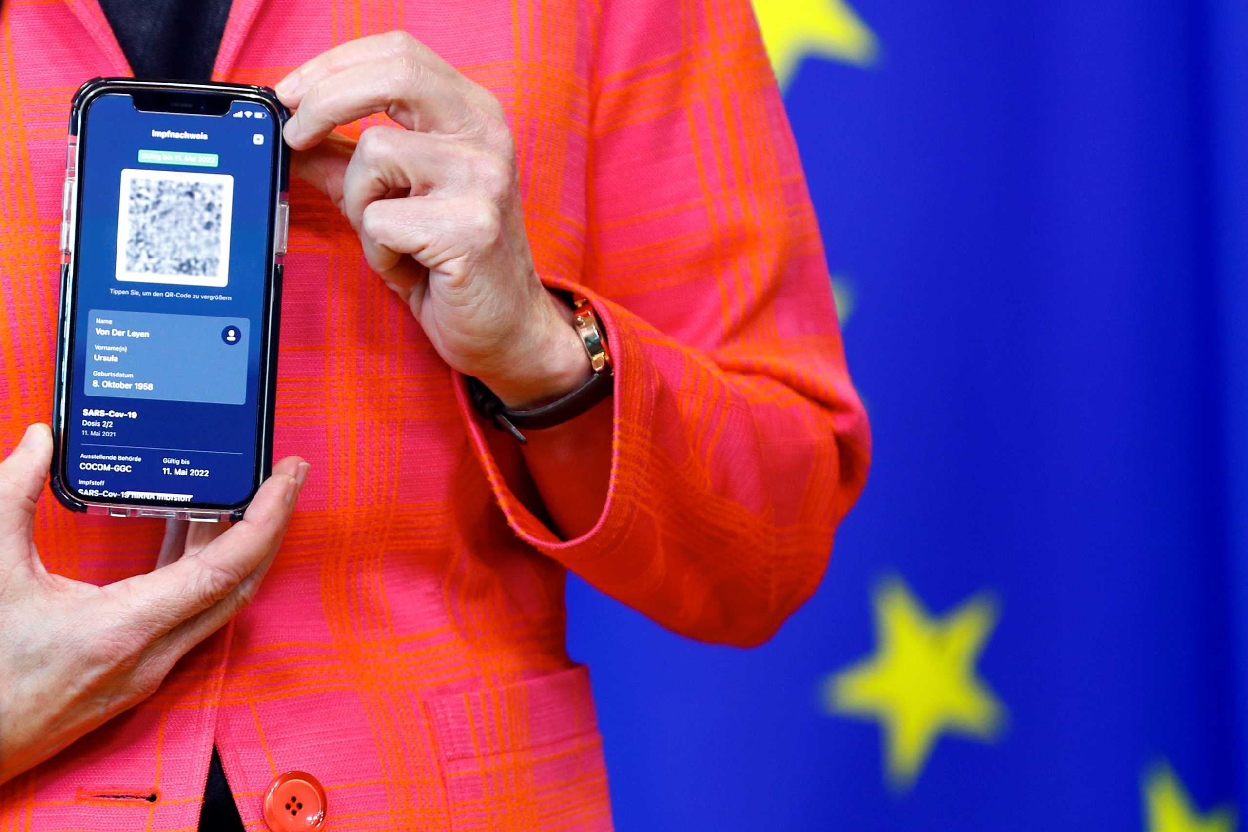 European Commission President Ursula von der Leyen holds a mobile phone as she gives a statement in Brussels, Belgium June 16, 2021. REUTERS