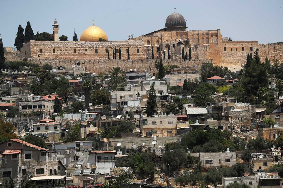 The Dome of the Rock on the compound known to Muslims as Noble Sanctuary and to Jews as Temple Mount, in Jerusalem's Old City, is seen in the background as part of the neighbourhood of Silwan in East Jerusalem is seen in the foreground June 28, 2021. Picture taken June 28, 2021. REUTERS