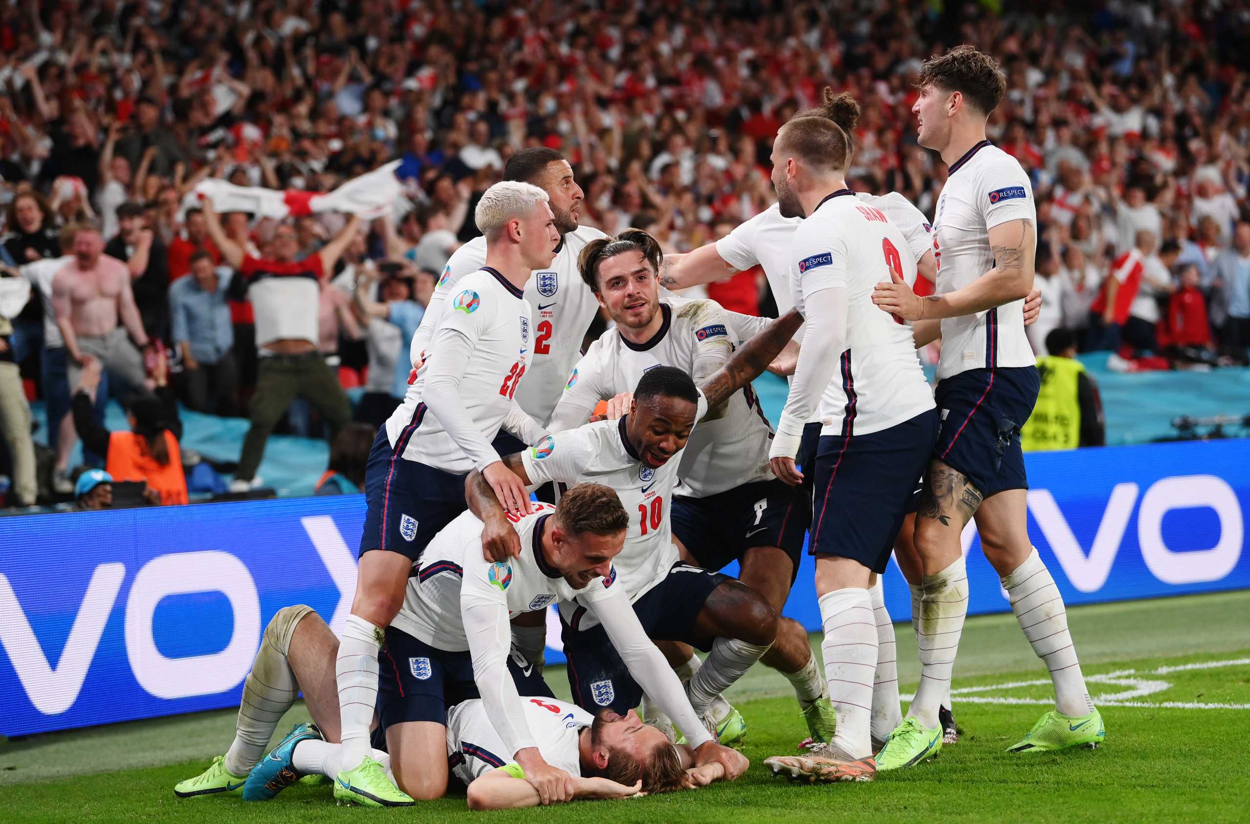 Soccer Football - Euro 2020 - Semi Final - England v Denmark - Wembley Stadium, London, Britain - July 7, 2021 England's Harry Kane celebrates scoring their second goal with teammates Pool via REUTERS