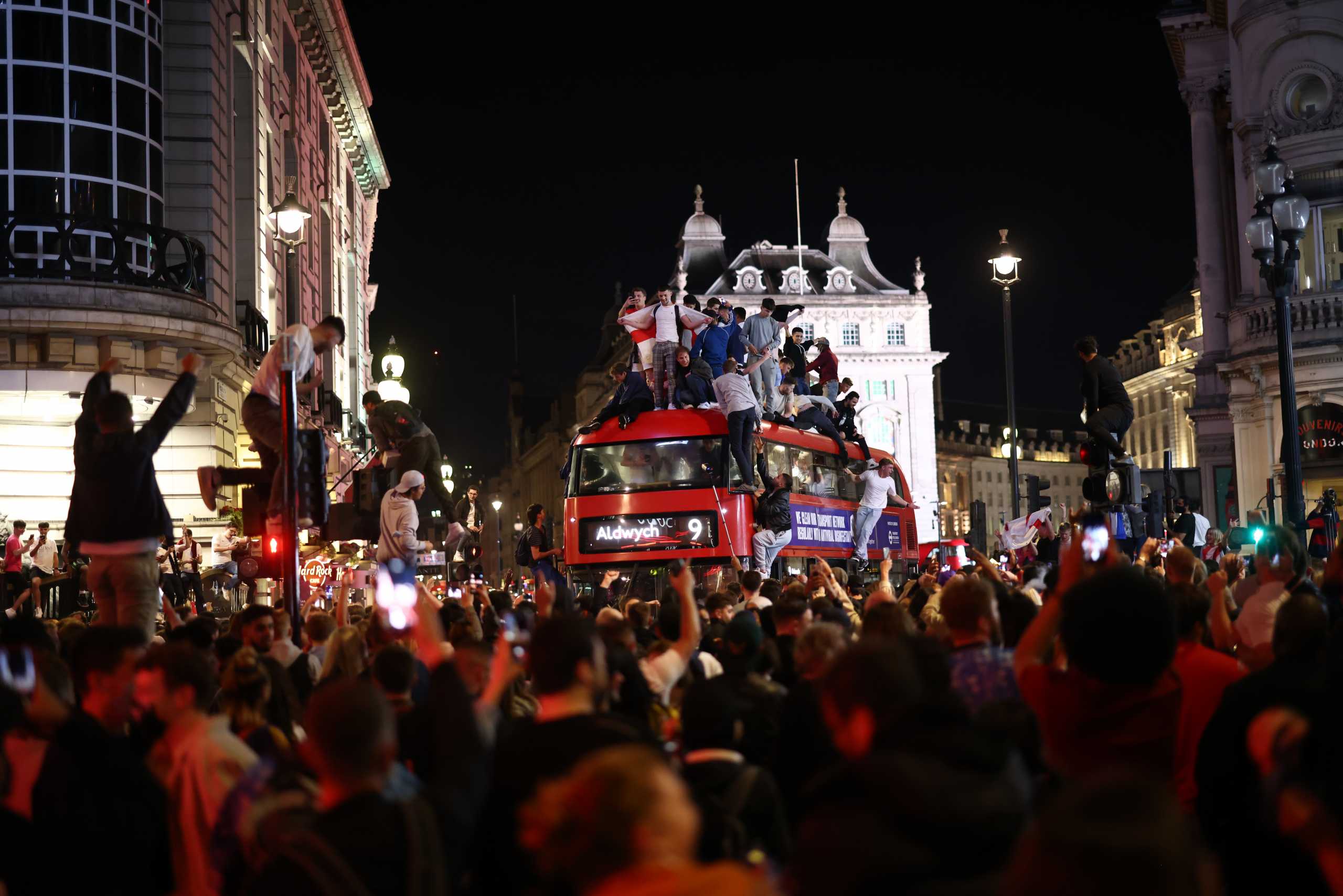 Soccer Football - Euro 2020 - Fans gather for England v Denmark - Piccadilly Circus, London, Britain - July 7, 2021 England fans celebrate after the match REUTERS