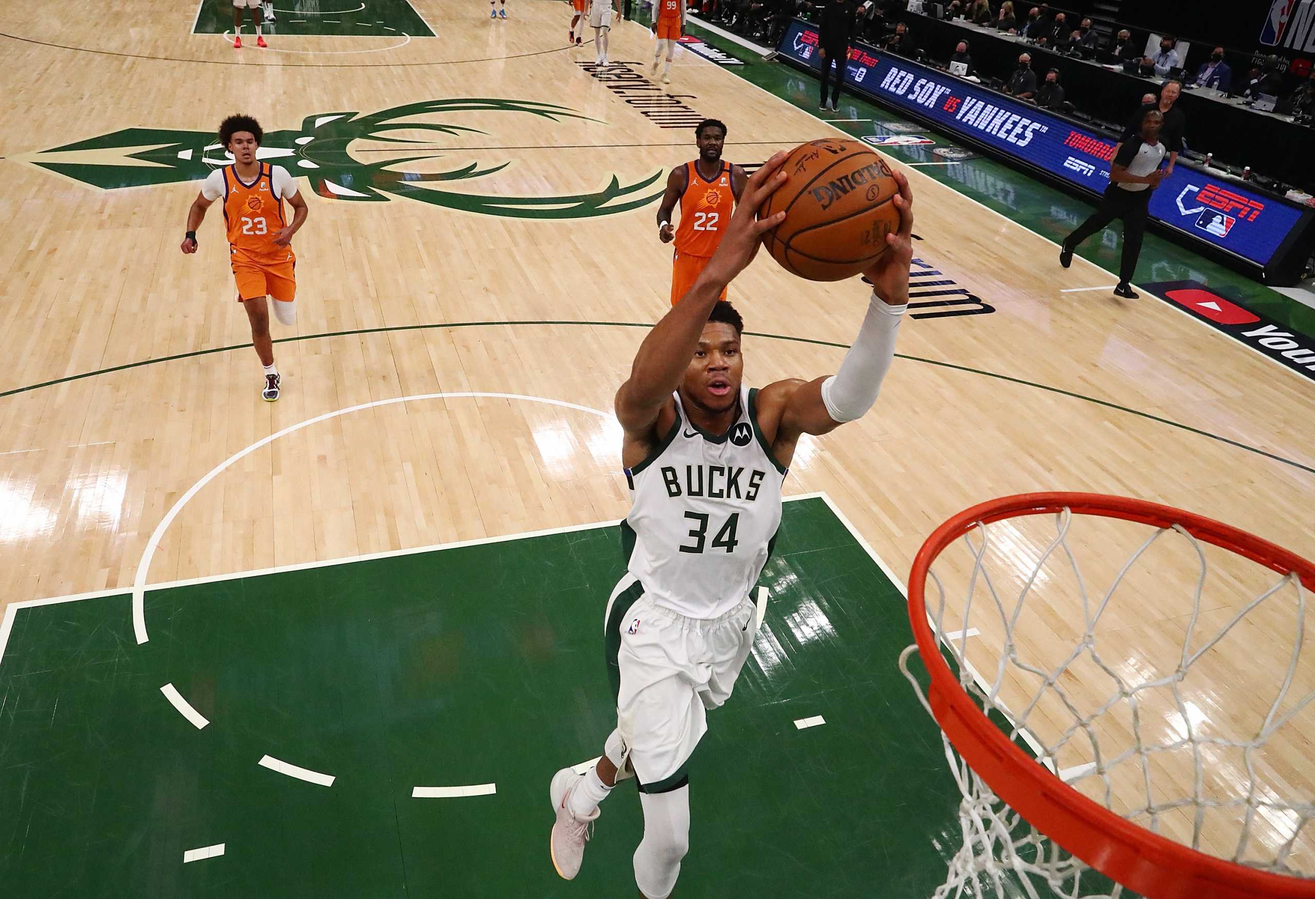 Jul 14, 2021; Milwaukee, Wisconsin, USA; Milwaukee Bucks forward Giannis Antetokounmpo (34) drives to the basket against the Phoenix Suns during game four of the 2021 NBA Finals at Fiserv Forum. Mandatory Credit: Mark J. Rebilas-USA TODAY Sports
