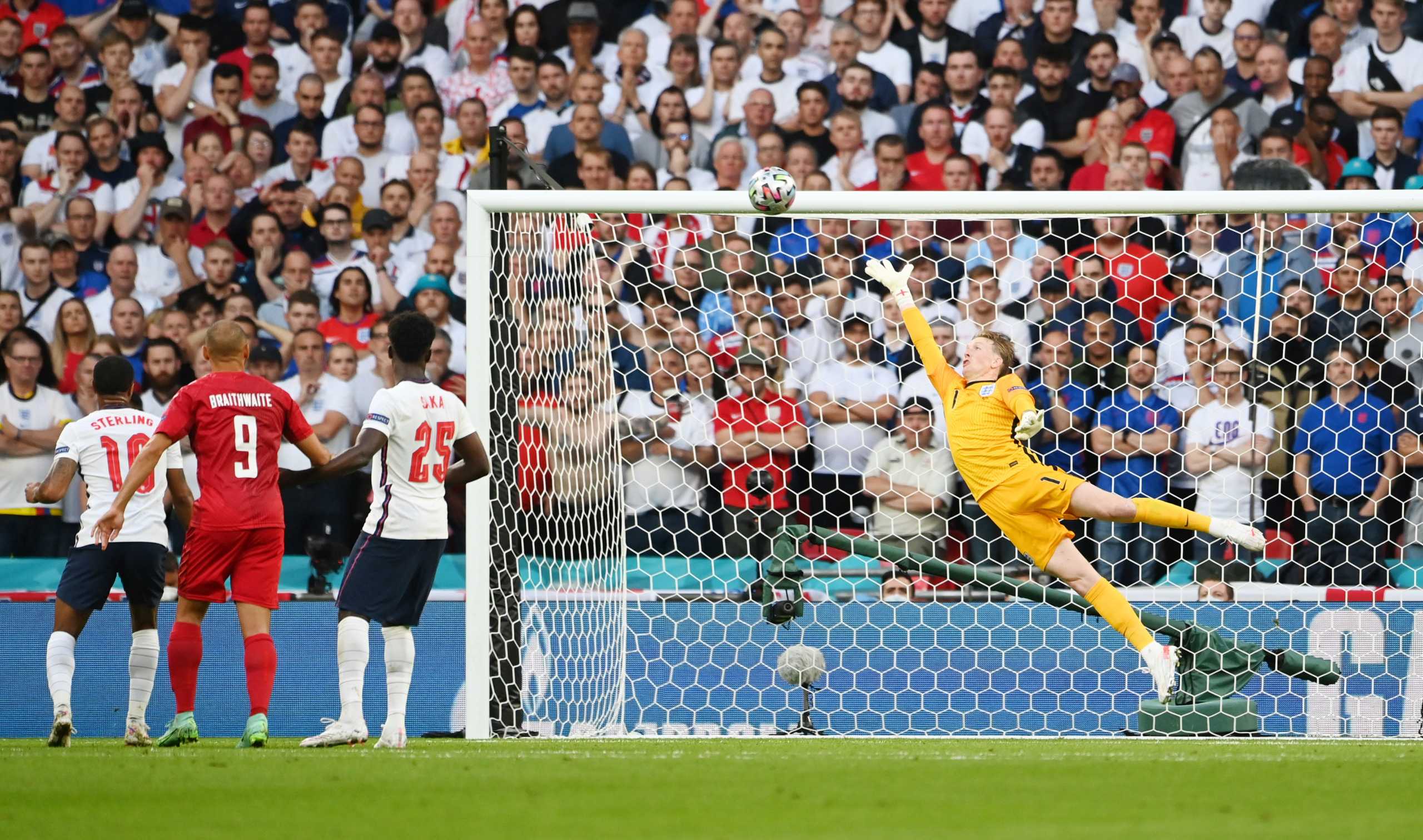 Soccer Football - Euro 2020 - Semi Final - England v Denmark - Wembley Stadium, London, Britain - July 7, 2021 Denmark's Mikkel Damsgaard scores their first goal past England's Jordan Pickford Pool via REUTERS