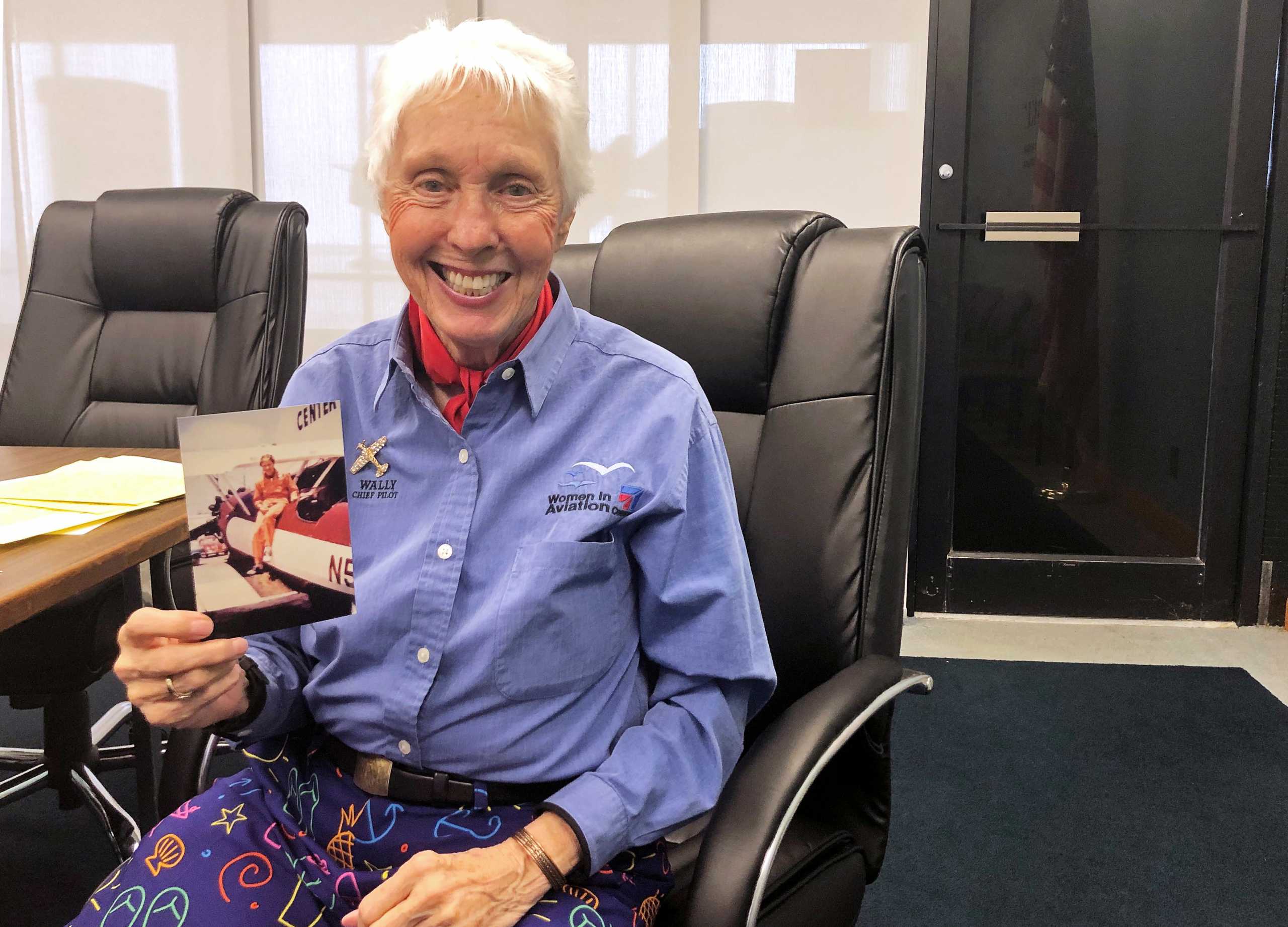 FILE PHOTO: Wally Funk, a Virgin Galactic ticketholder and one of the First Lady Astronaut Trainees or ‘Mercury 13’ women, is pictured holding a photo of herself at the International Women’s Air and Space Museum in Cleveland, Ohio, U.S. March 29, 2019. REUTERS