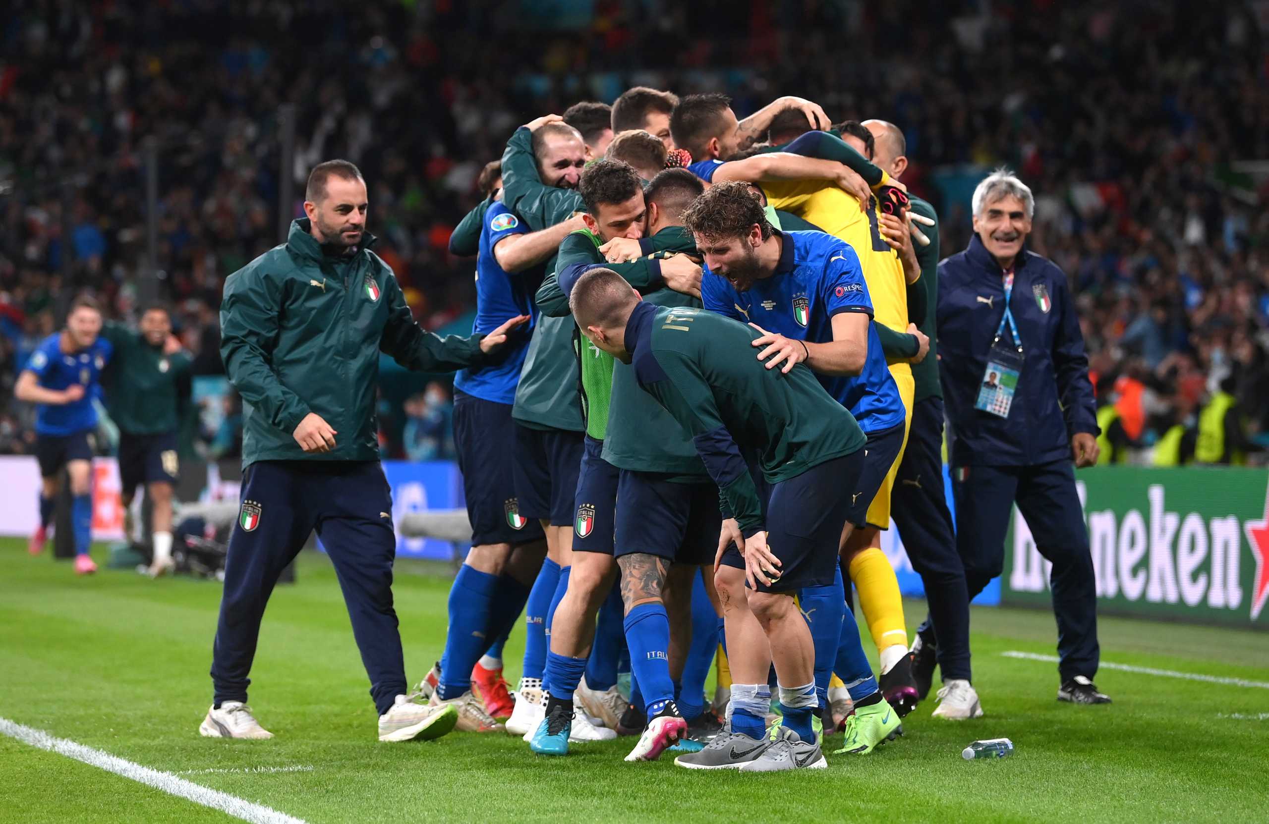 Soccer Football - Euro 2020 - Semi Final - Italy v Spain - Wembley Stadium, London, Britain - July 6, 2021 Italy's Gianluigi Donnarumma and teammates celebrate reaching the final after winning the penalty shoot-out Pool via REUTERS