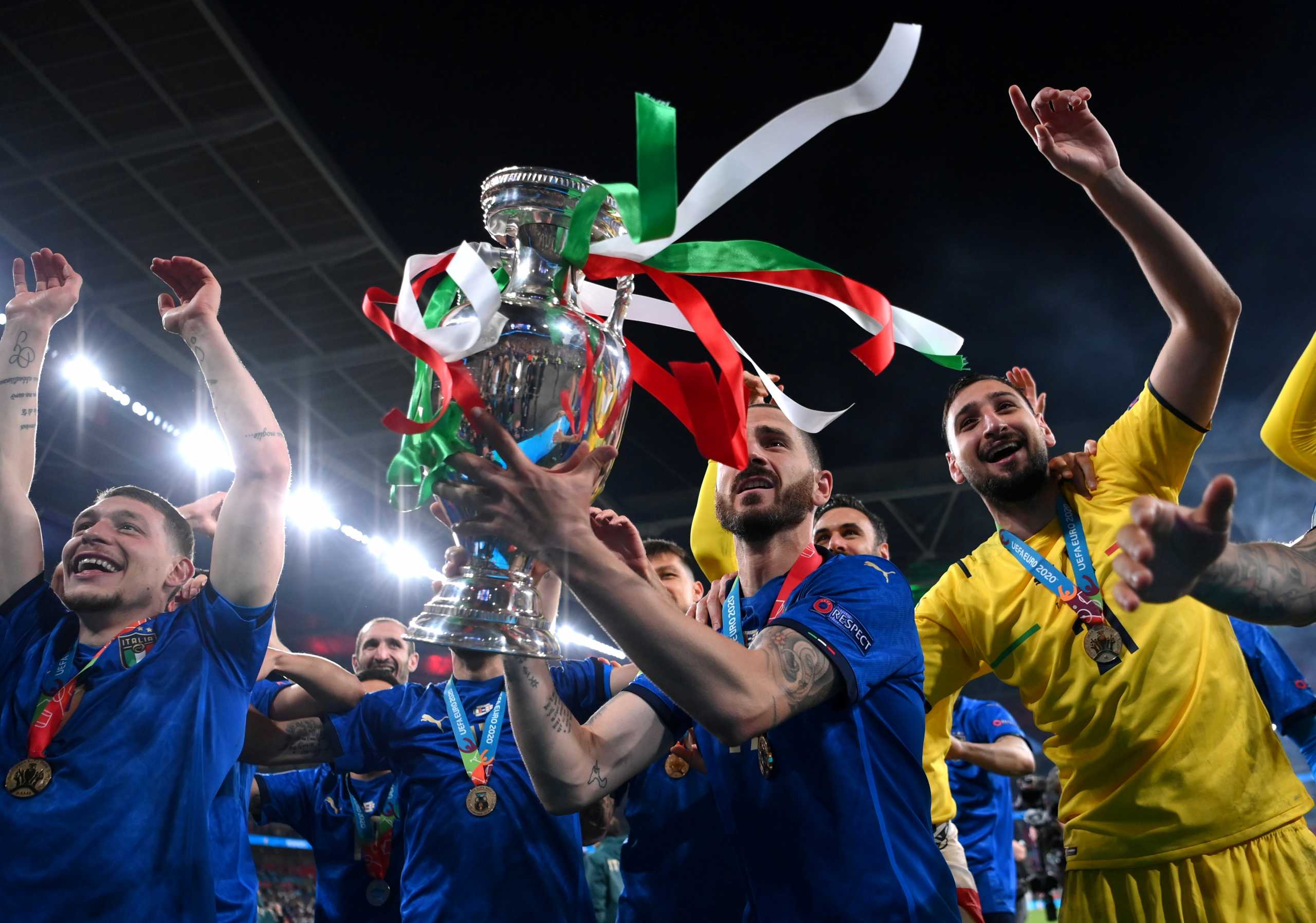 Soccer Football - Euro 2020 - Final - Italy v England - Wembley Stadium, London, Britain - July 11, 2021 Italy's Leonardo Bonucci and teammates celebrate with the trophy after winning Euro 2020 Pool via REUTERS