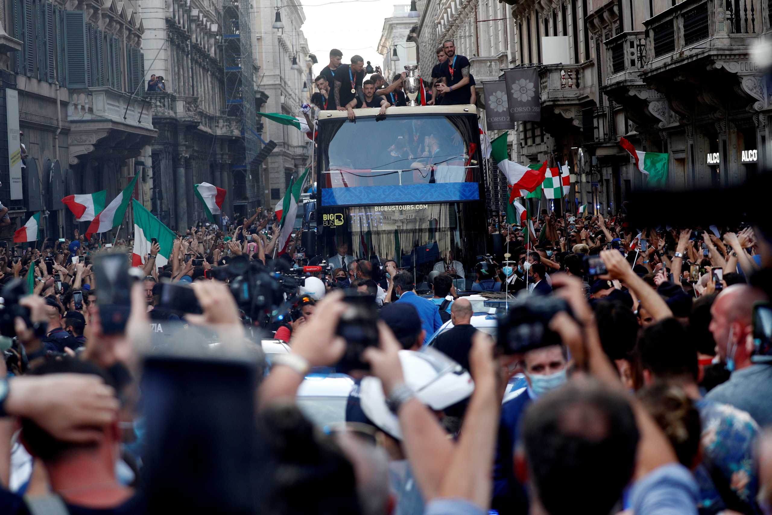 FILE PHOTO: Soccer Football - Euros 2020 - The Italy team drive through Rome on a open top bus tour amidst celebrating fans after winning the Euros 2020, July 12, 2021. REUTERS