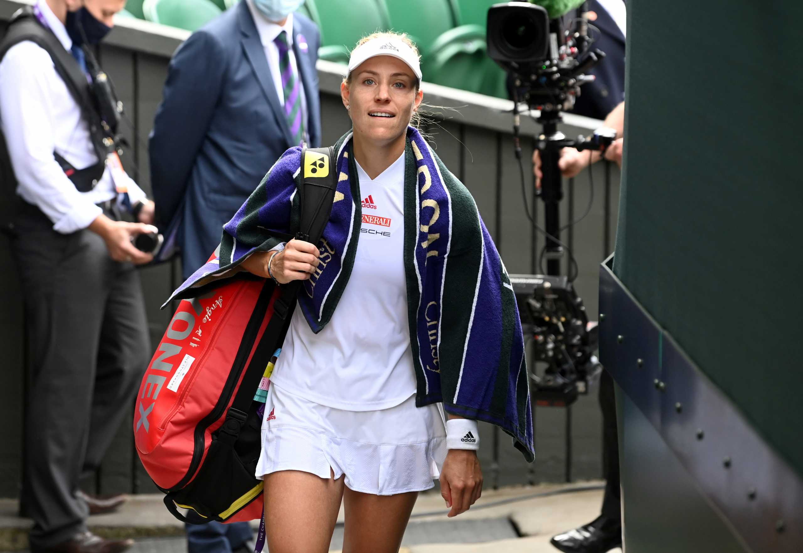 FILE PHOTO: Tennis - Wimbledon - All England Lawn Tennis and Croquet Club, London, Britain - July 8, 2021 Germany's Angelique Kerber reacts after losing her semi final match against Australia's Ashleigh Barty REUTERS