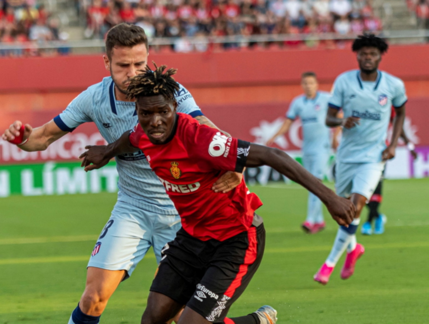 epa07869215 Mallorca's midfielder Lumor Agbenyenu (R) in action against Atletico de Madrid's midfielder Saul Niguez (L) during the Spanish LaLiga match between RCD Mallorca and Atletico de Madrid at Son Moix stadium in Mallorca, Balearic Island, Spain, 25 September 2019.  EPA