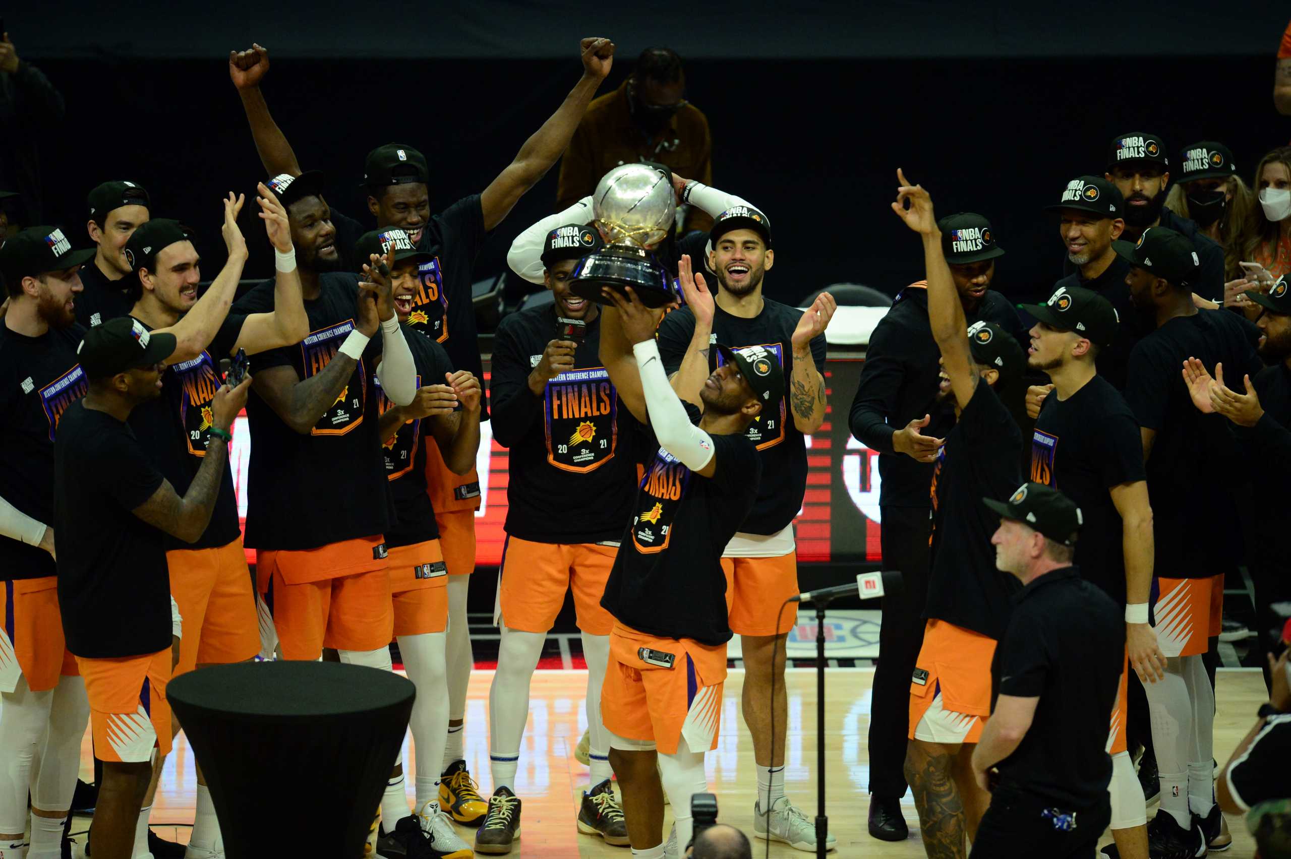 Jun 30, 2021; Los Angeles, California, USA; Phoenix Suns guard Chris Paul (3) lifts the Western Conference champions trophy following the series victory against the Los Angeles Clippers in game six of the Western Conference Finals for the 2021 NBA Playoffs at Staples Center. Mandatory Credit: Gary A. Vasquez-USA TODAY Sports