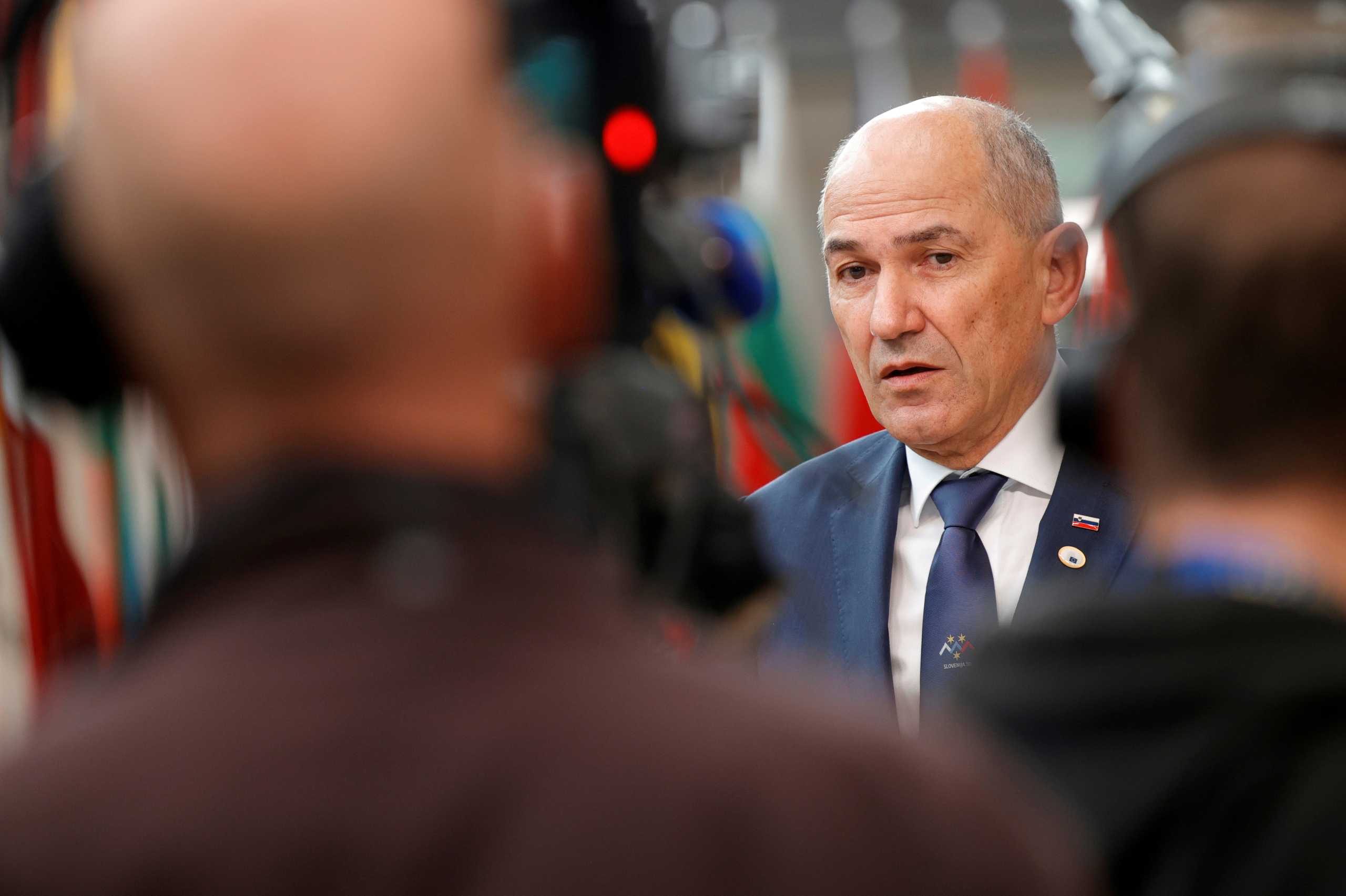 FILE PHOTO: Slovenia's Prime Minister Janez Jansa talks to journalists as he arrives for the second day of a EU summit at the European Council building in Brussels, Belgium June 25, 2021. Olivier Matthys