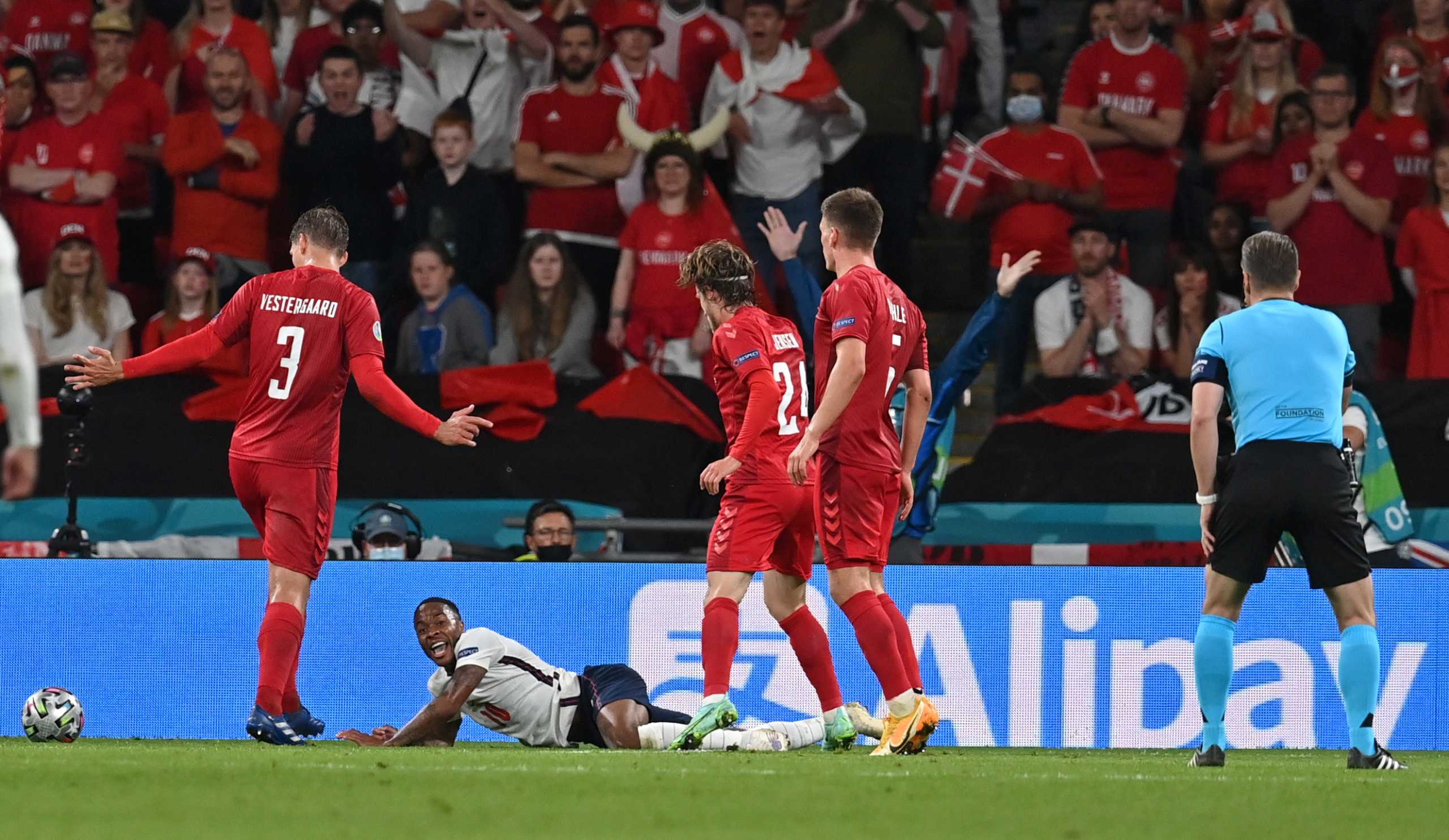 Soccer Football - Euro 2020 - Semi Final - England v Denmark - Wembley Stadium, London, Britain - July 7, 2021 Referee Danny Makkelie awards a penalty to England after a challenge on England's Raheem Sterling Pool via REUTERS
