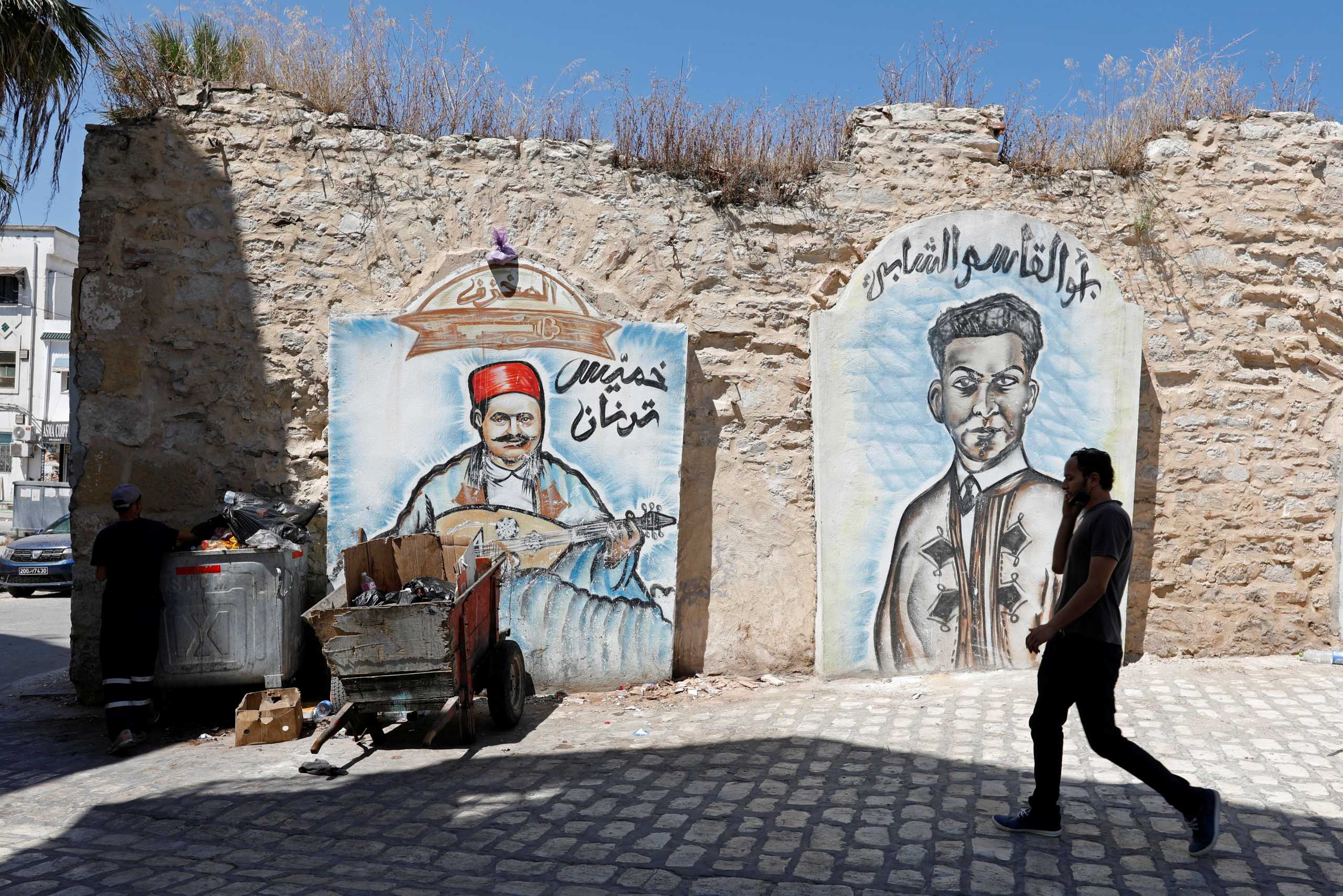 A man walks in Bab Souika district, near the Old City of Tunis, Tunisia, June 13, 2021. Picture taken June 13, 2021. REUTERS