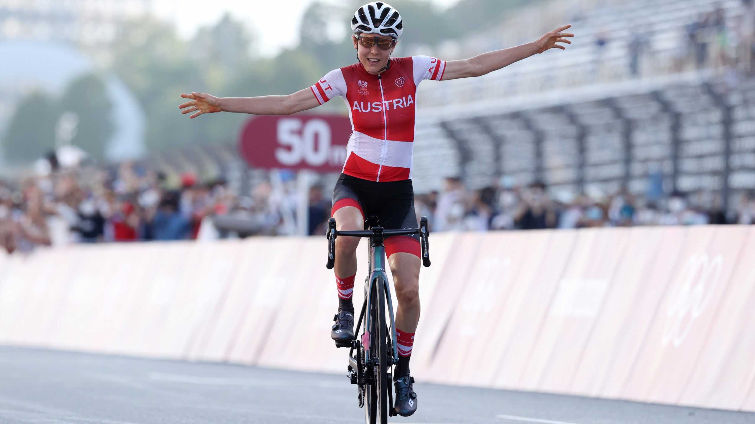 Tokyo 2020 Olympics - Cycling - Road - Women's Road Race - Final - Tokyo to Fuji International Speedway - Tokyo, Japan - July 25, 2021.  Anna Kiesenhofer of Austria celebrates winning gold. Pool via REUTERS