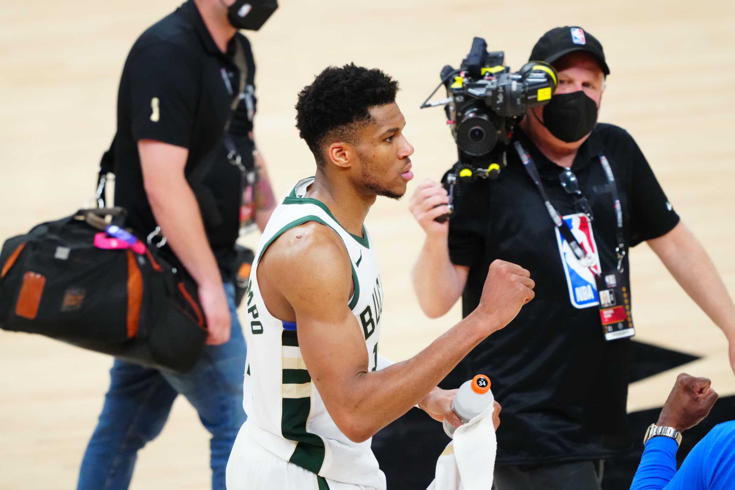 Jul 17, 2021; Phoenix, Arizona, USA; Milwaukee Bucks forward Giannis Antetokounmpo (34) celebrates after defeating the Phoenix Suns during game five of the 2021 NBA Finals at Phoenix Suns Arena. Mandatory Credit: Mark J. Rebilas-USA TODAY Sports