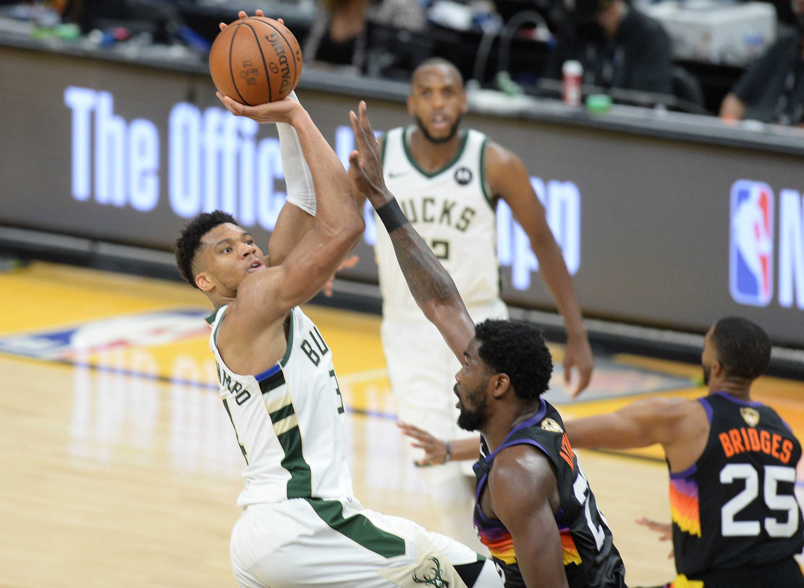 Jul 8, 2021; Phoenix, Arizona, USA; Milwaukee Bucks forward Giannis Antetokounmpo (34) shoots against Phoenix Suns center Deandre Ayton (22) during the second half in game two of the 2021 NBA Finals at Phoenix Suns Arena. Mandatory Credit: Joe Camporeale-USA TODAY Sports