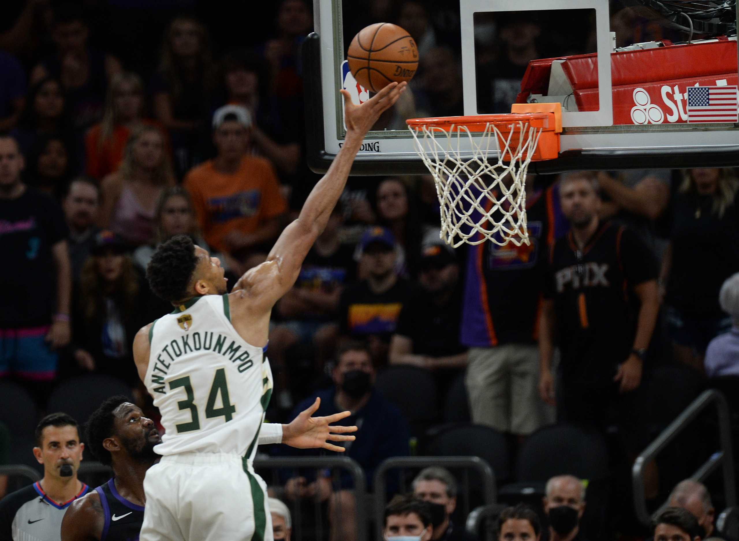 Jul 8, 2021; Phoenix, Arizona, USA; Milwaukee Bucks forward Giannis Antetokounmpo (34) shoots for a basket against the Phoenix Suns during the second half in game two of the 2021 NBA Finals at Phoenix Suns Arena. Mandatory Credit: Joe Camporeale-USA TODAY Sports