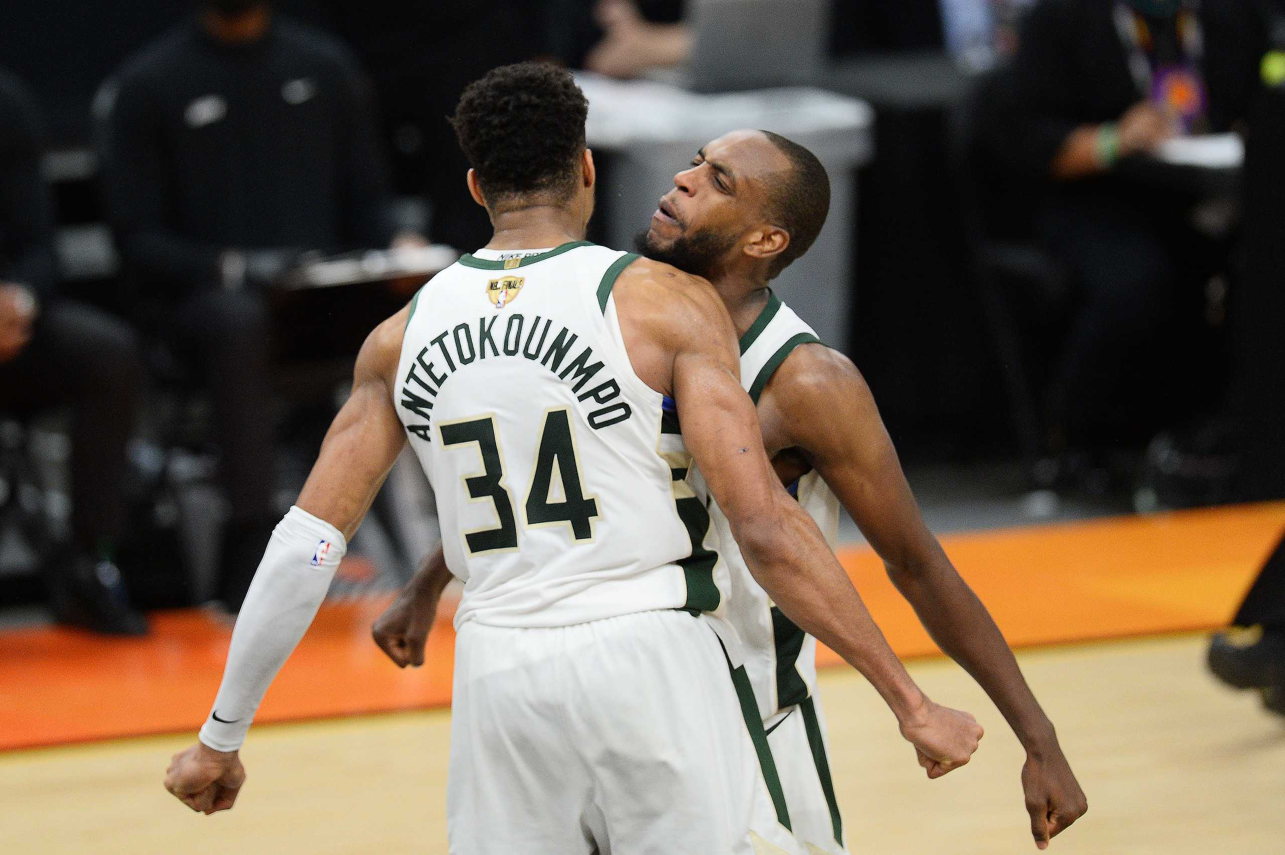 Jul 17, 2021; Phoenix, Arizona, USA; Milwaukee Bucks forward Khris Middleton (22) celebrates with Bucks forward Giannis Antetokounmpo (34) after defeating the Phoenix Suns in game five of the 2021 NBA Finals at Phoenix Suns Arena. Mandatory Credit: Joe Camporeale-USA TODAY Sports