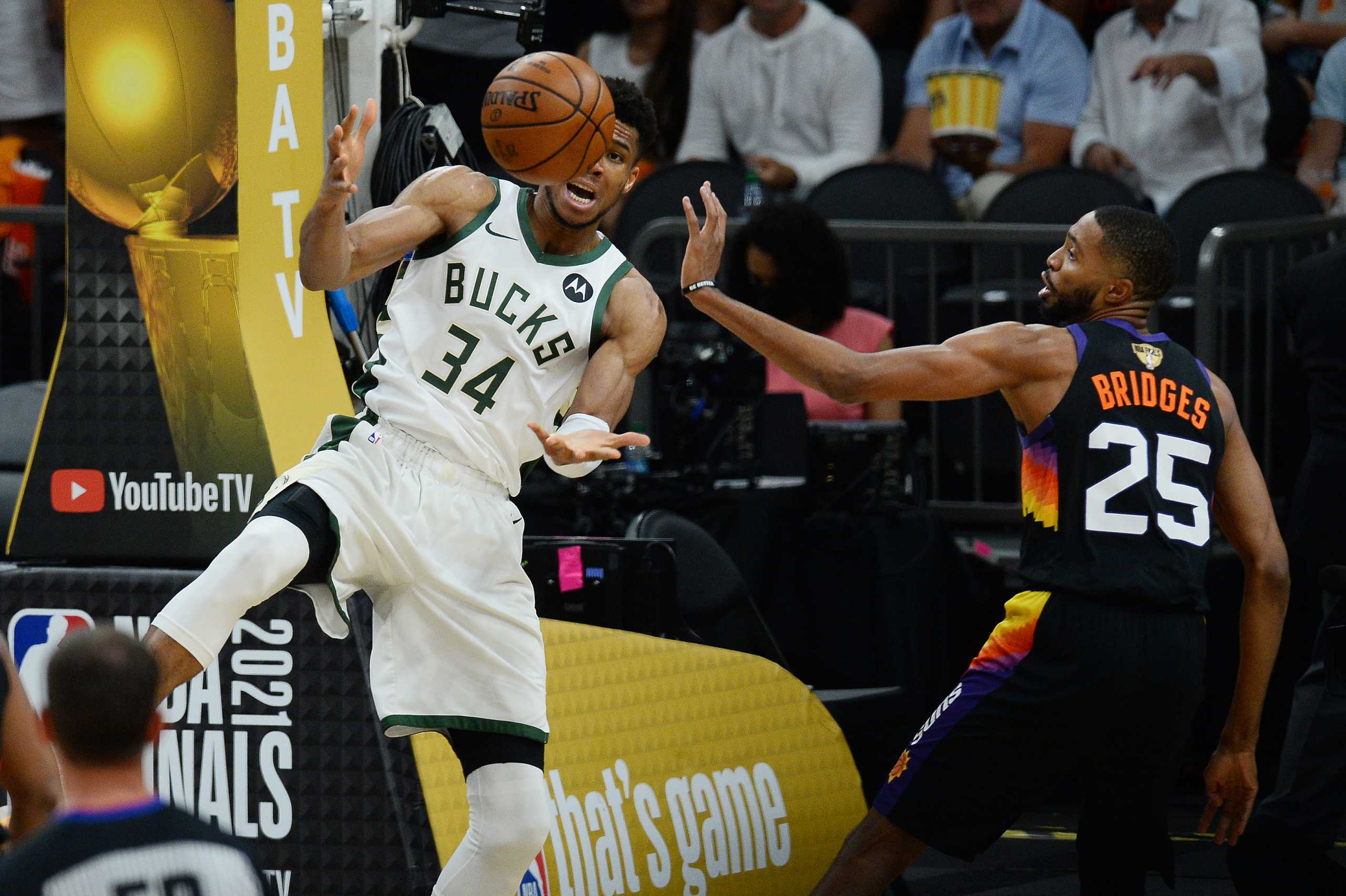 Jul 17, 2021; Phoenix, Arizona, USA; Milwaukee Bucks forward Giannis Antetokounmpo (34) battles for the ball with Phoenix Suns forward Mikal Bridges (25) in the second half during game five of the 2021 NBA Finals at Phoenix Suns Arena. Mandatory Credit: Joe Camporeale-USA TODAY Sports