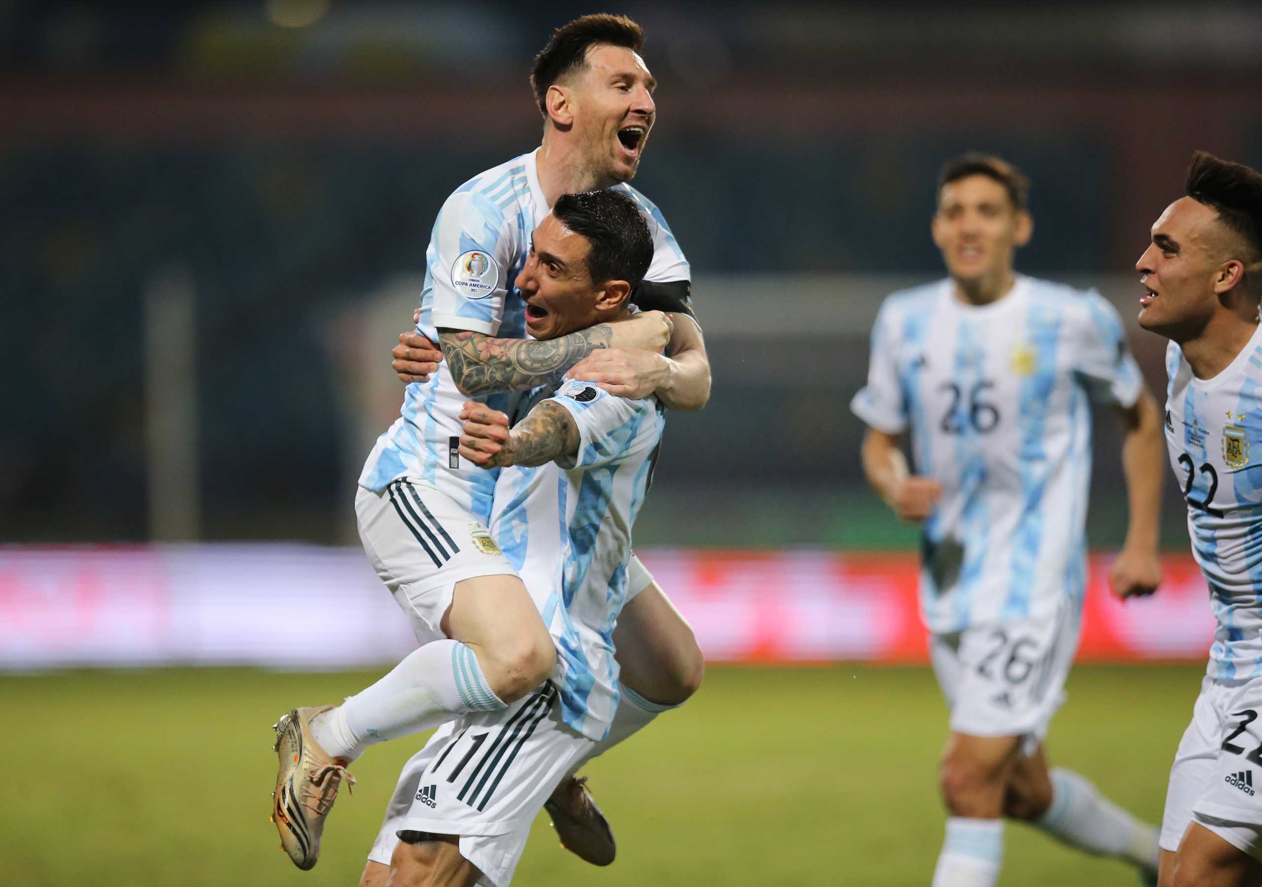 Soccer Football - Copa America 2021 - Quarter Final - Argentina v Ecuador - Estadio Olimpico, Goiania, Brazil - July 3, 2021 Argentina's Lionel Messi celebrates scoring their third goal with Angel Di Maria REUTERS