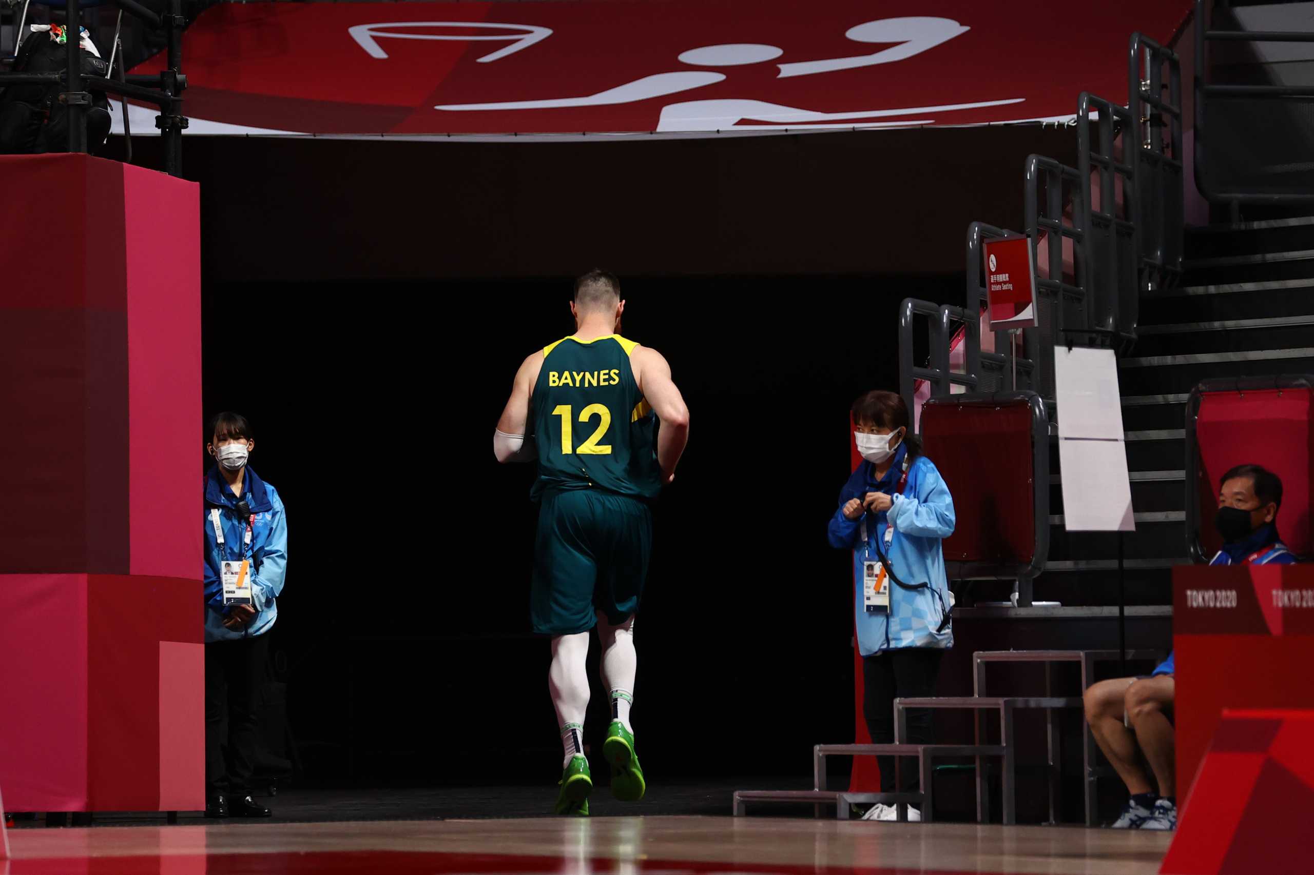 Tokyo 2020 Olympics - Basketball - Men - Group B - Italy v Australia - Saitama Super Arena, Saitama, Japan - July 28, 2021. Aron Baynes of Australia walks out of the court before the end of the match REUTERS