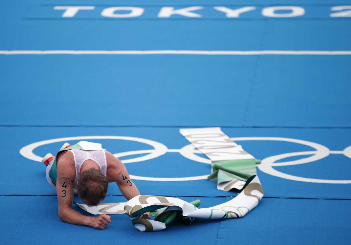 Tokyo 2020 Olympics - Triathlon - Men's Olympic Distance - Final - Odaiba Marine Park, Tokyo, Japan – July 26, 2021.  Kristian Blummenfelt of Norway celebrates victory. REUTERS