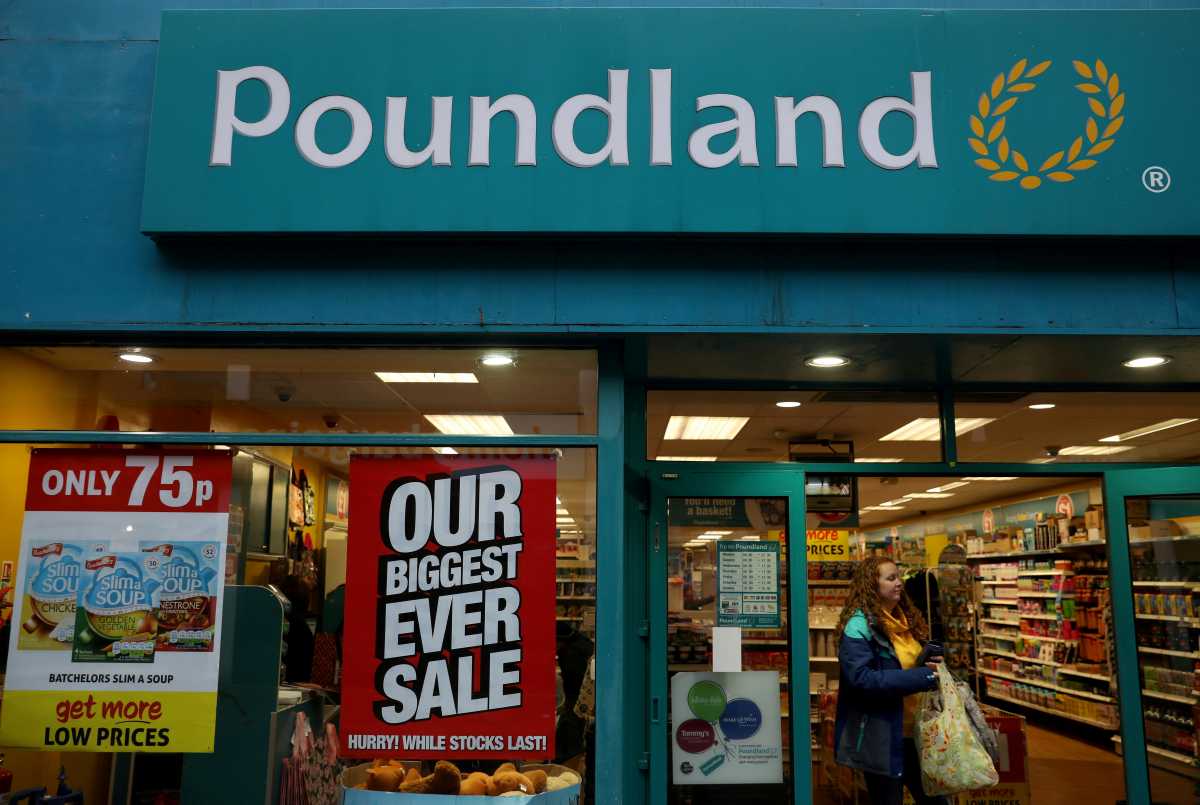 FILE PHOTO: A woman leaves a branch of Poundland in Altrincham, Britain January 7 2020. REUTERS