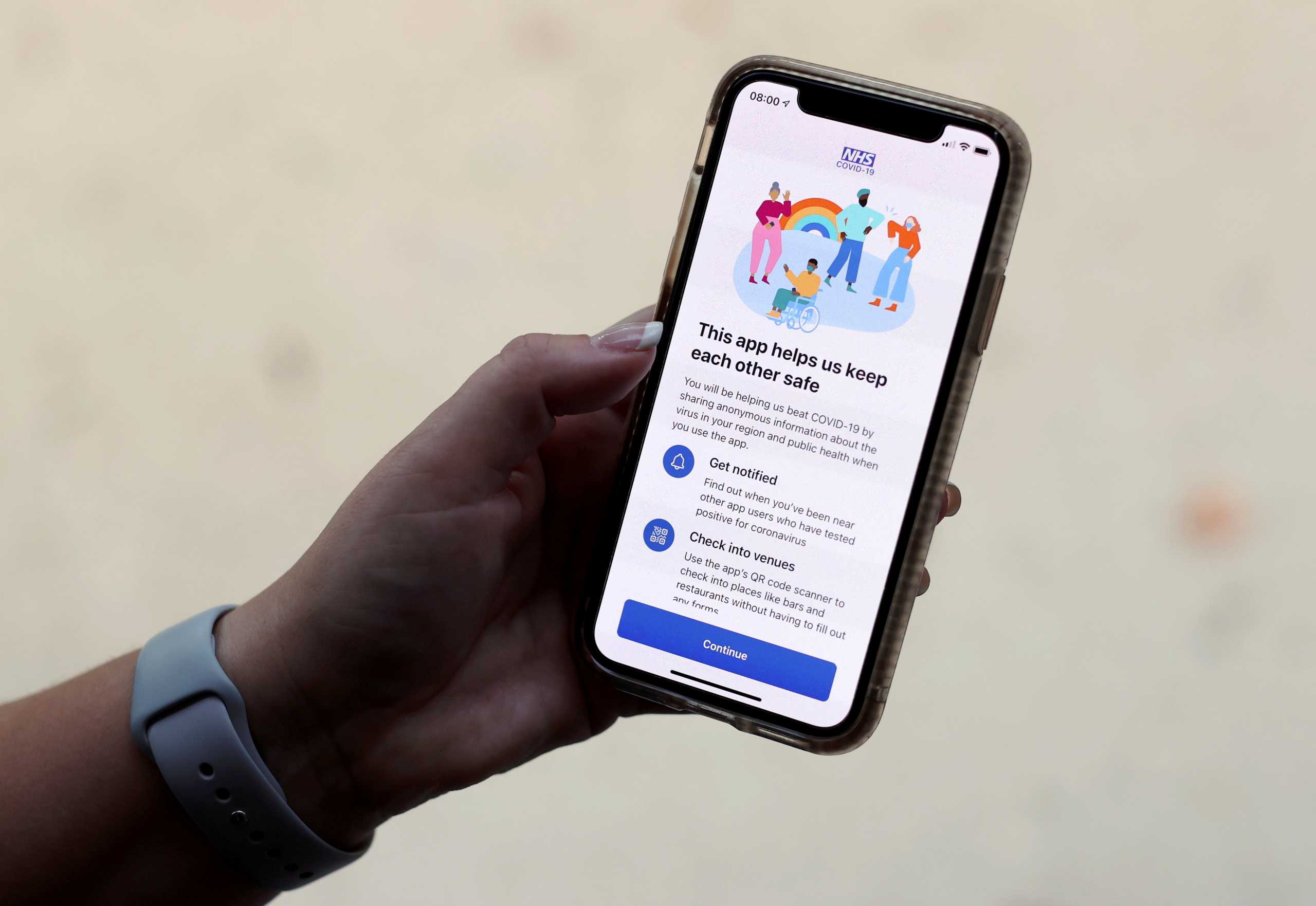 FILE PHOTO: The coronavirus disease (COVID-19) contact tracing smartphone app of Britain's National Health Service (NHS) is displayed on an iPhone in this illustration photograph taken in Keele, Britain, September 24, 2020. REUTERS