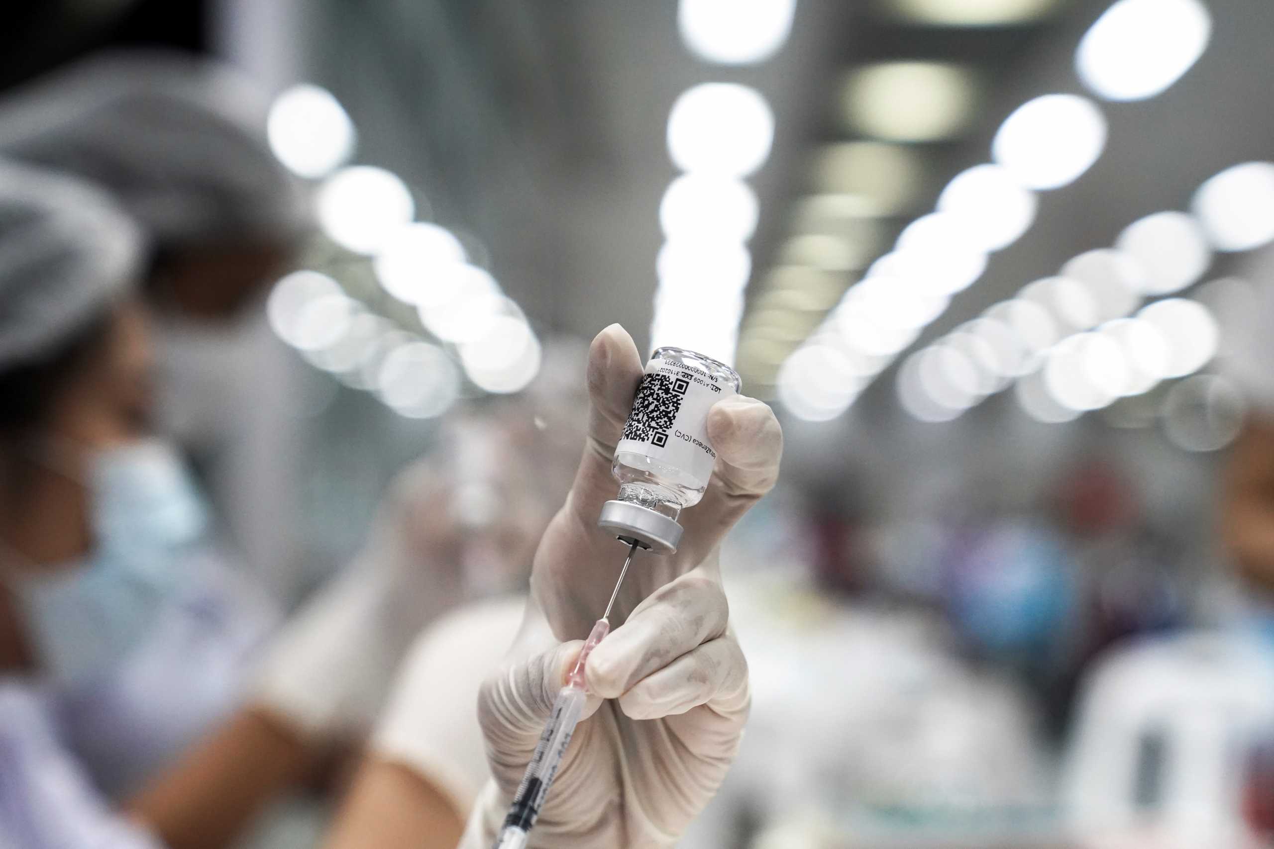 A health worker prepares a dose of AstraZeneca COVID-19 vaccine against the coronavirus disease (COVID-19) at the Central Vaccination Center, inside the Bang Sue Grand Station, Thailand, June 21, 2021. REUTERS