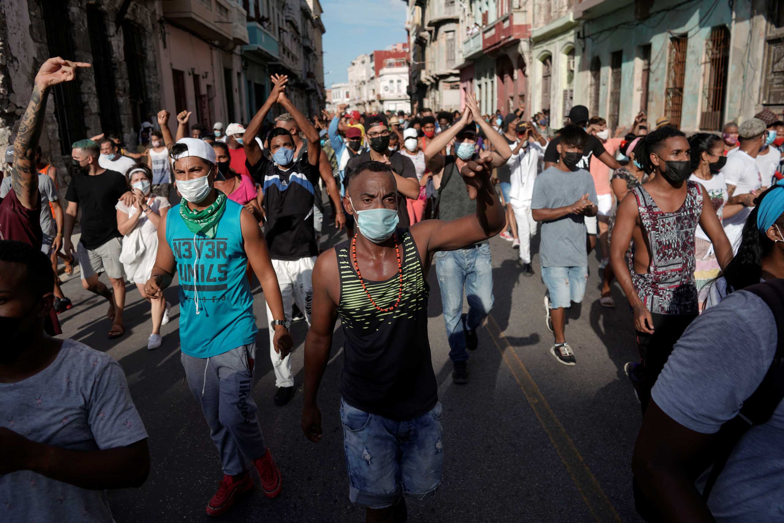 People shout slogans against the government during a protest against and in support of the government, amidst the coronavirus disease (COVID-19) outbreak, in Havana, Cuba July 11, 2021. REUTERS