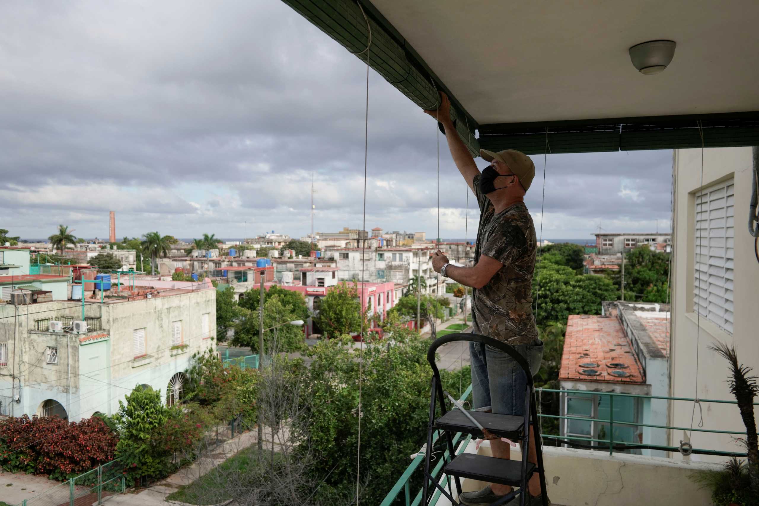Otto Gonzalez prepares his home for the arrival of Storm Elsa, Havana, Cuba, July 5, 2021. REUTERS