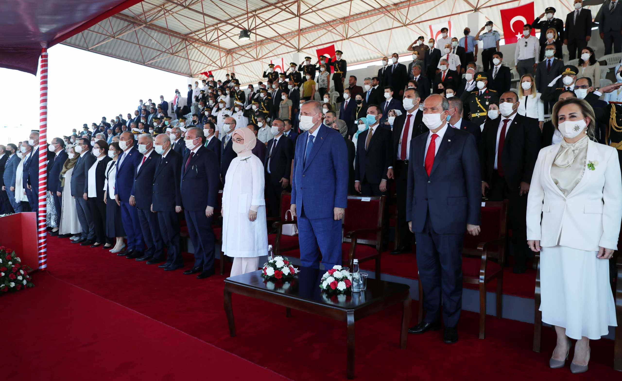 Turkish President Tayyip Erdogan and Turkish Cypriot leader Ersin Tatar attend a military parade during the second day of Erdogan's official visit to the Turkish Republic of Northern Cyprus, a breakaway state recognised only by Turkey, in northern Nicosia, Cyprus July 20, 2021. Murat Cetinmuhurdar