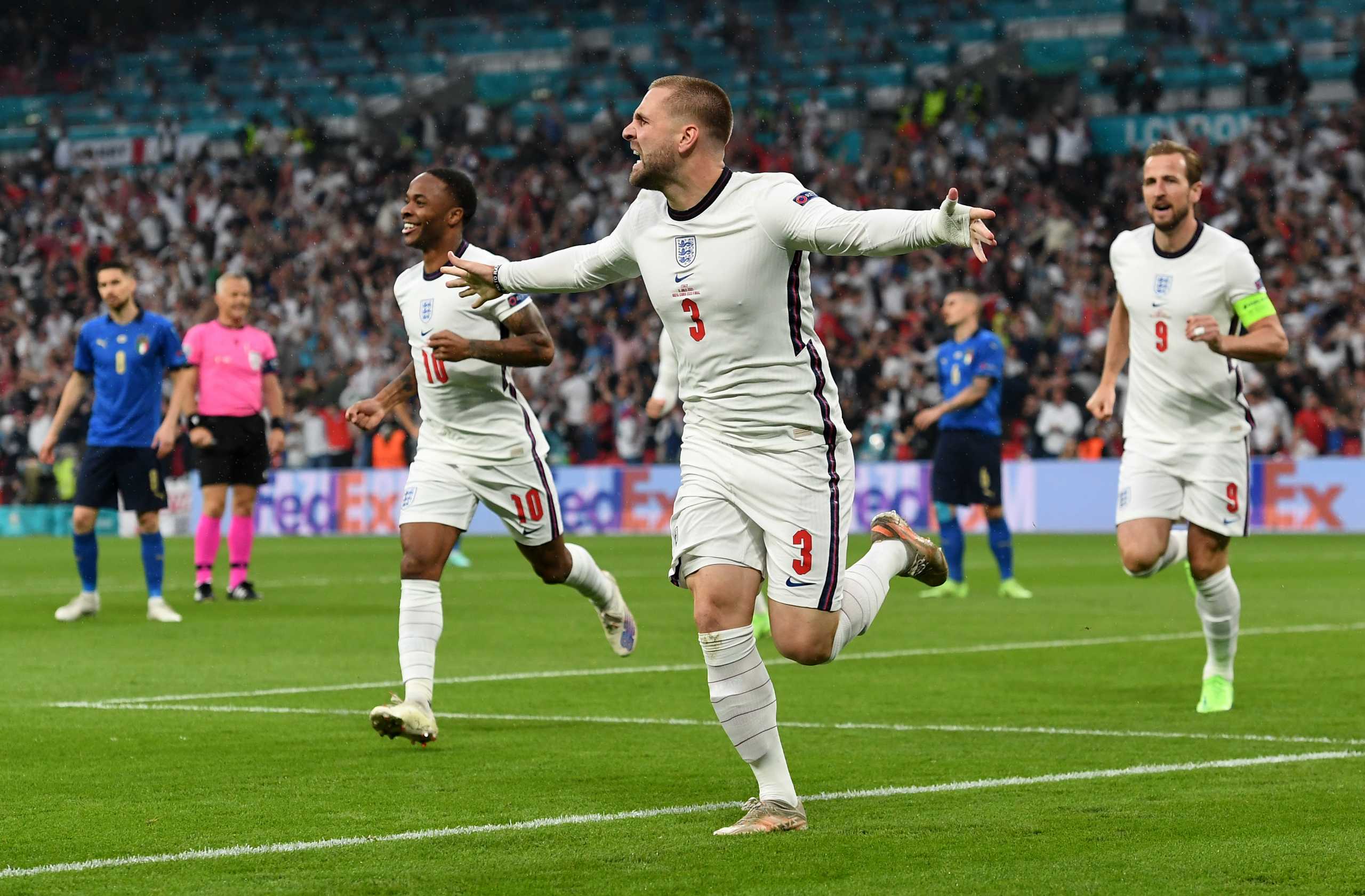 Soccer Football - Euro 2020 - Final - Italy v England - Wembley Stadium, London, Britain - July 11, 2021 England's Luke Shaw celebrates scoring their first goal with teammates Pool via REUTERS