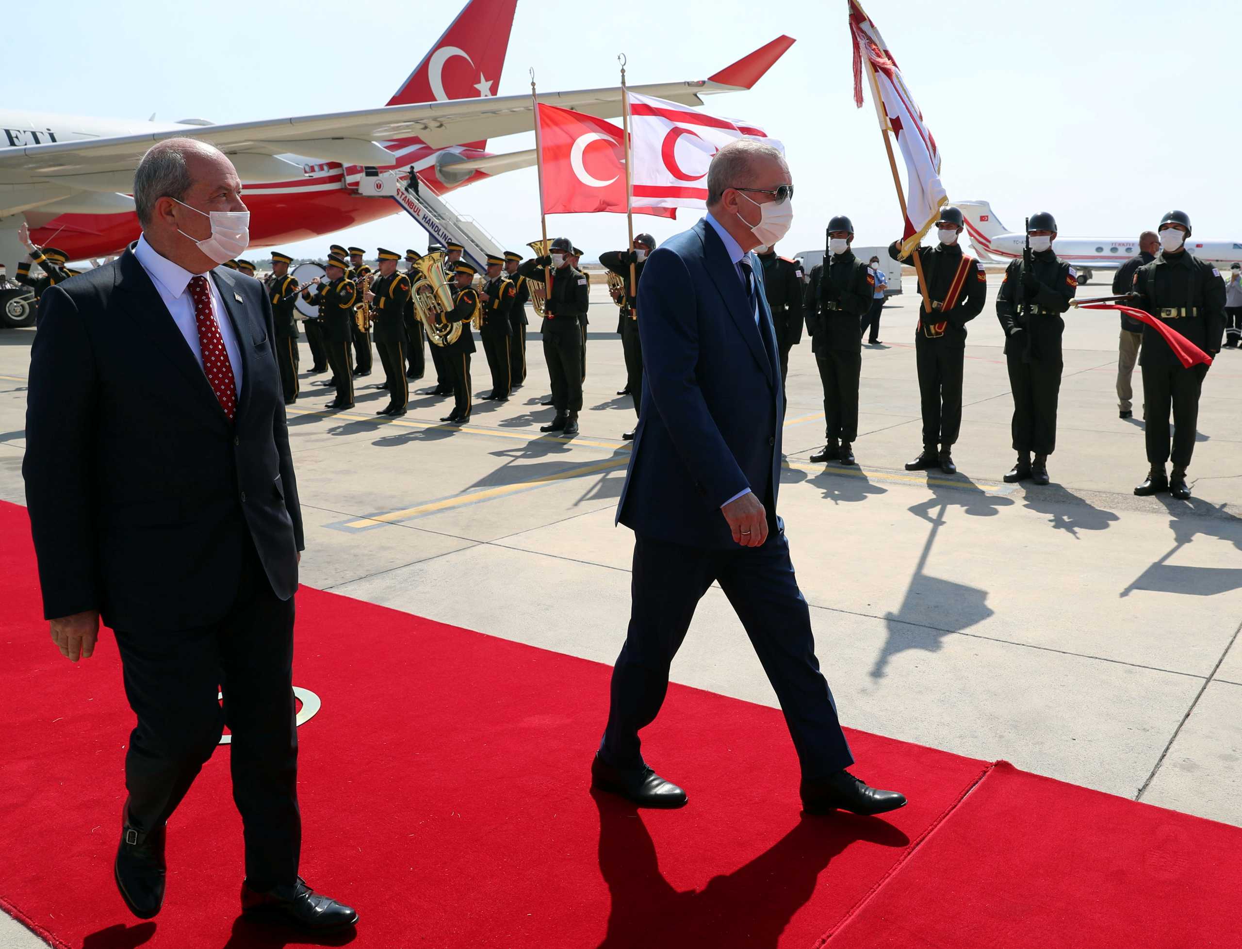 Turkish President Tayyip Erdogan reviews a guard of honour with Turkish Cypriot leader Ersin Tatar as he arrives to the Turkish Republic of Northern Cyprus, a breakway state recognized only by Turkey, in northern Nicosia, Cyprus July 19, 2021. Murat Cetinmuhurdar