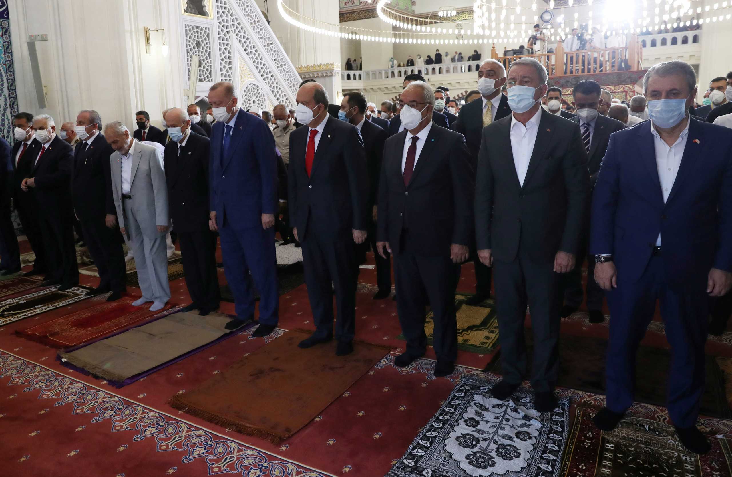 Turkish President Tayyip Erdogan and Turkish Cypriot leader Ersin Tatar attend Eid al-Adha prayers during the second day of Erdogan's official visit to the Turkish Republic of Northern Cyprus, a breakaway state recognised only by Turkey, in northern Nicosia, Cyprus July 20, 2021. Murat Cetinmuhurdar