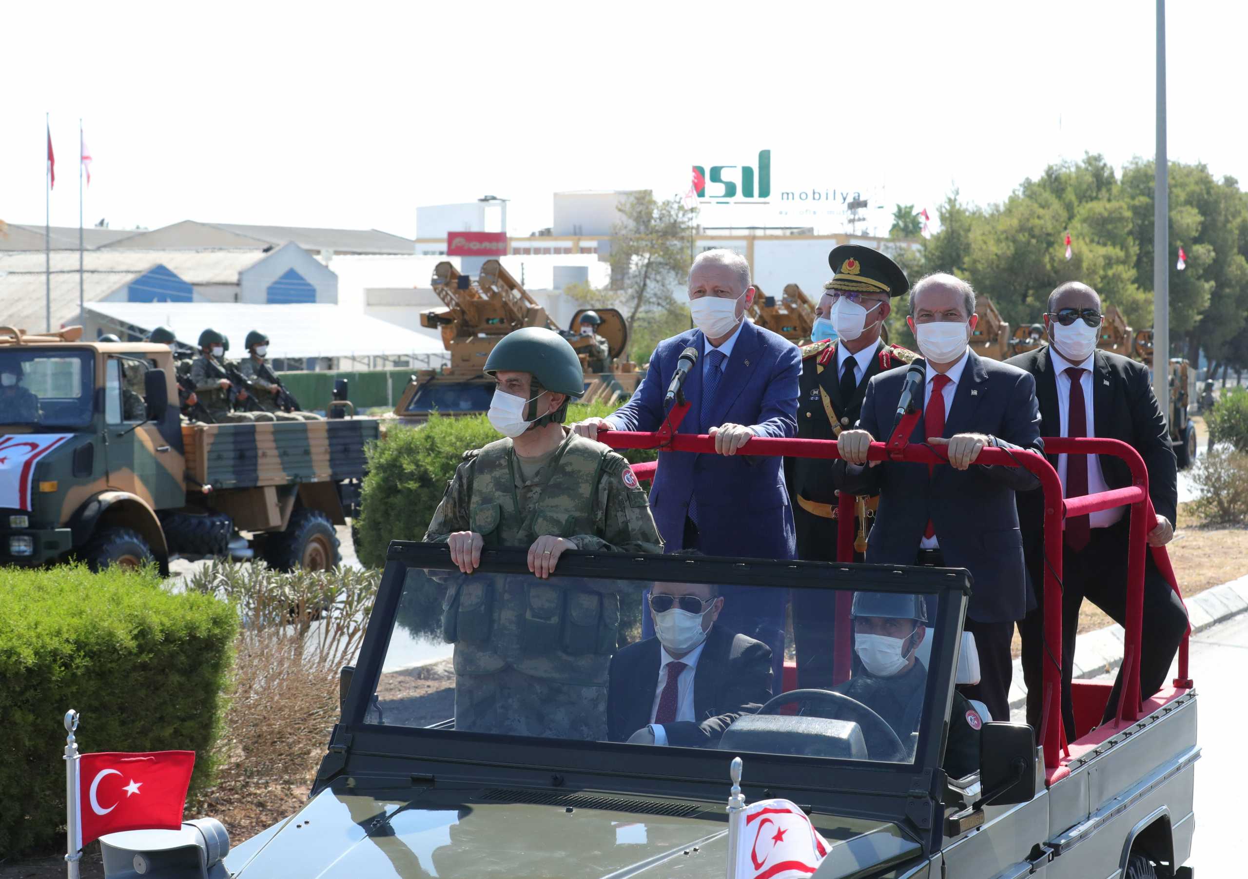 Turkish President Tayyip Erdogan and Turkish Cypriot leader Ersin Tatar attend a military parade during the second day of Erdogan's official visit to the Turkish Republic of Northern Cyprus, a breakaway state recognised only by Turkey, in northern Nicosia, Cyprus July 20, 2021. Murat Cetinmuhurdar