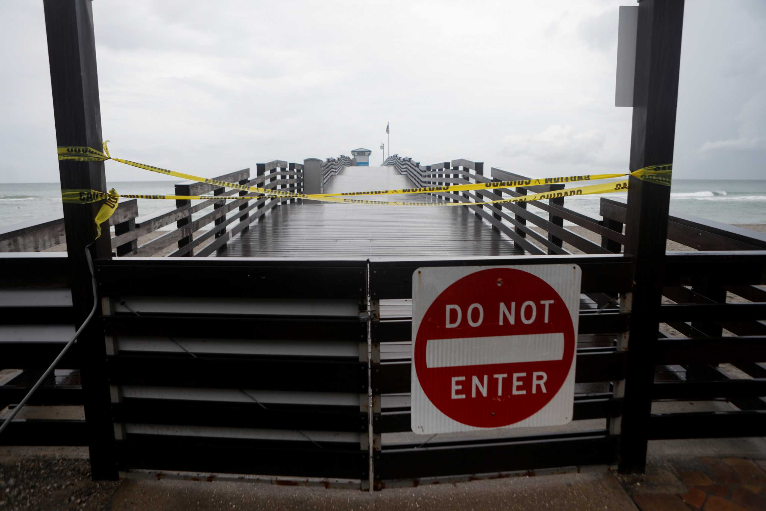 Dark clouds from Tropical Storm Elsa loom over Venice Fishing Pier at Brohard Park at Venice Beach, Florida, U.S.  July 6, 2021. REUTERS