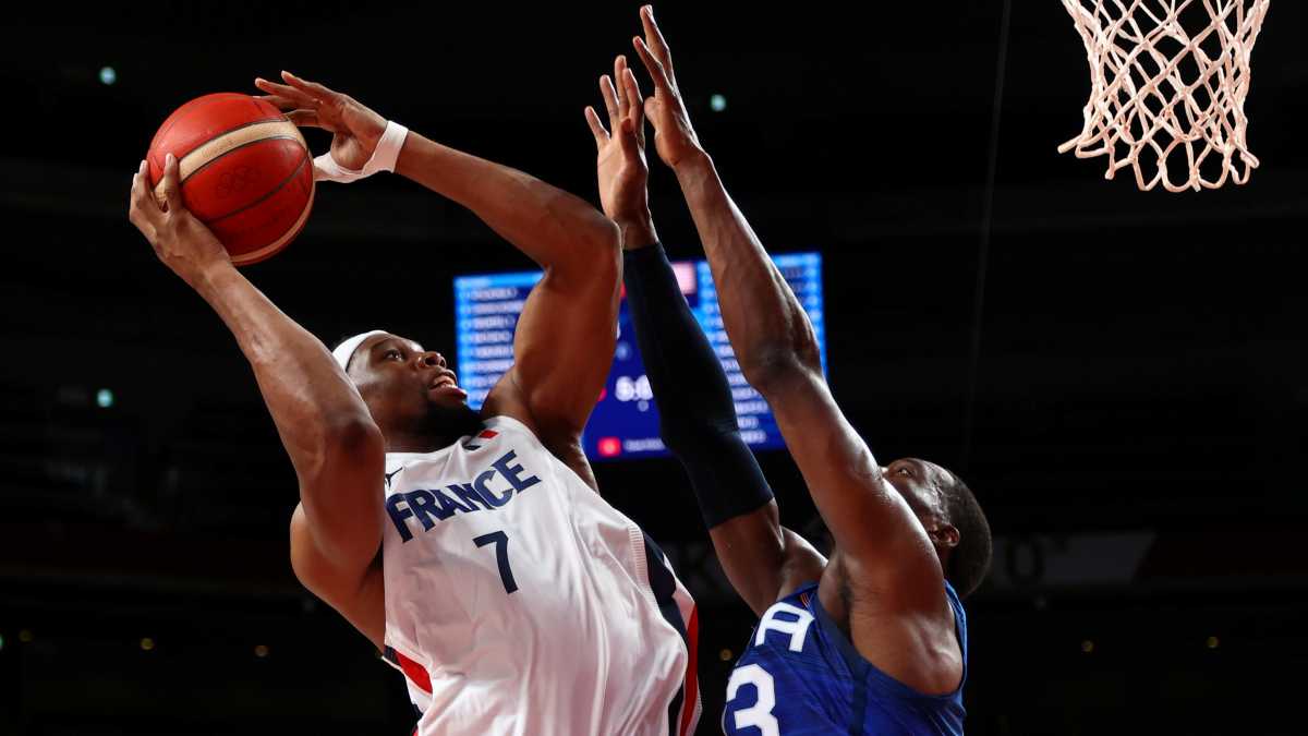 Tokyo 2020 Olympics - Basketball - Men - Group A - France v United States - Saitama Super Arena, Saitama, Japan - July 25, 2021. Guerschon Yabusele of France in action with Edrice Adebayo of the United States REUTERS