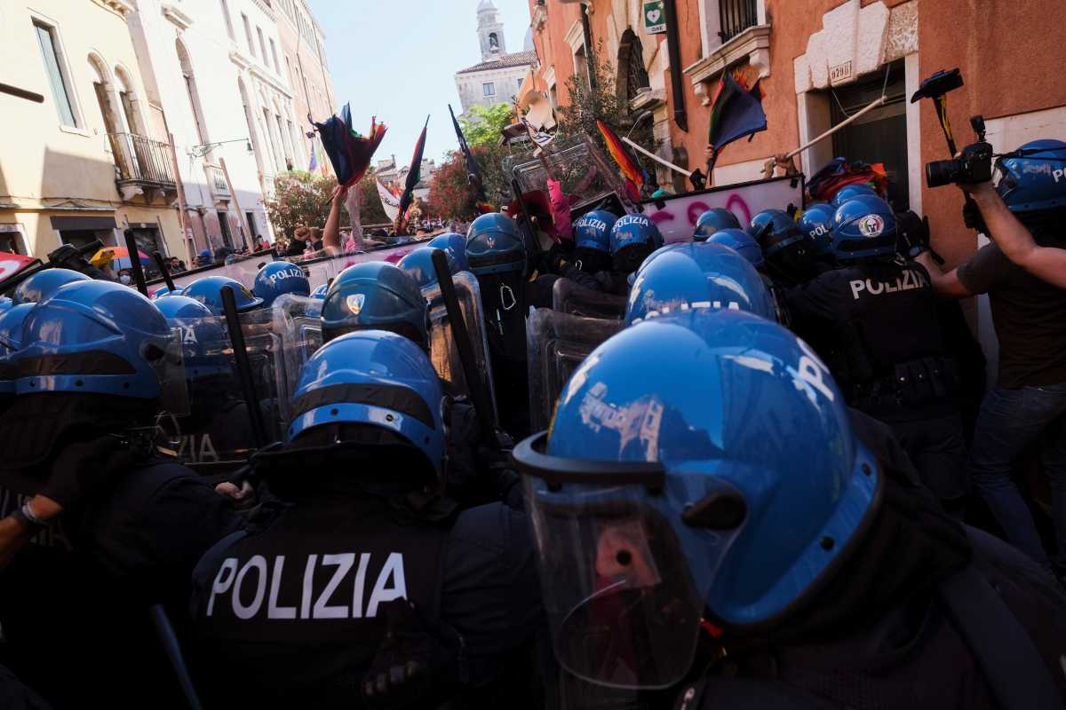 Demonstrators clash with police during a protest against finance ministers from G20 countries as they meet in Venice, in Venice, Italy, July 10, 2021. REUTERS