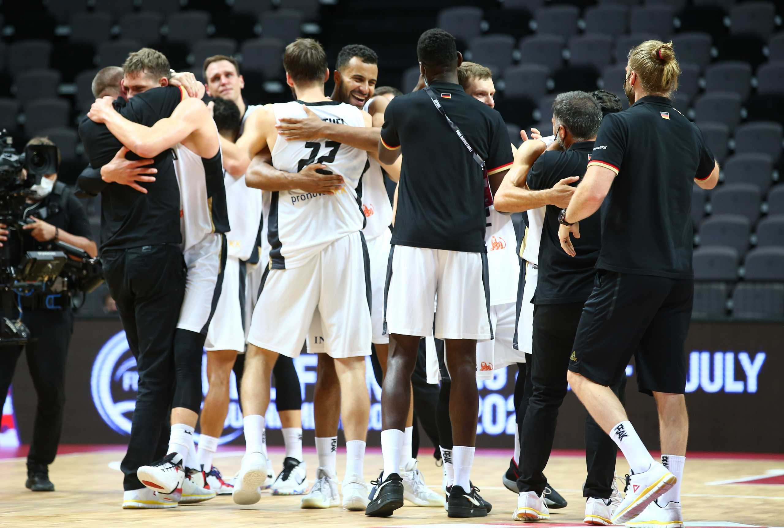Basketball - FIBA Olympic Qualifying Tournament Final - Germany v Brazil - Spaladium Arena, Split, Croatia - July 4, 2021 Germany players celebrate after the match and qualification for the Tokyo 2020 Olympic Games REUTERS