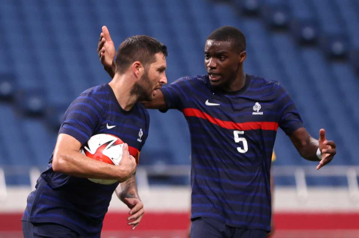 Tokyo 2020 Olympics - Soccer Football - Men - Group A - France v South Africa - Saitama Stadium, Saitama, Japan - July 25, 2021. Andre-Pierre Gignac of France celebrates scoring their third goal and completing his hat trick with Niels Nkounkou of France REUTERS