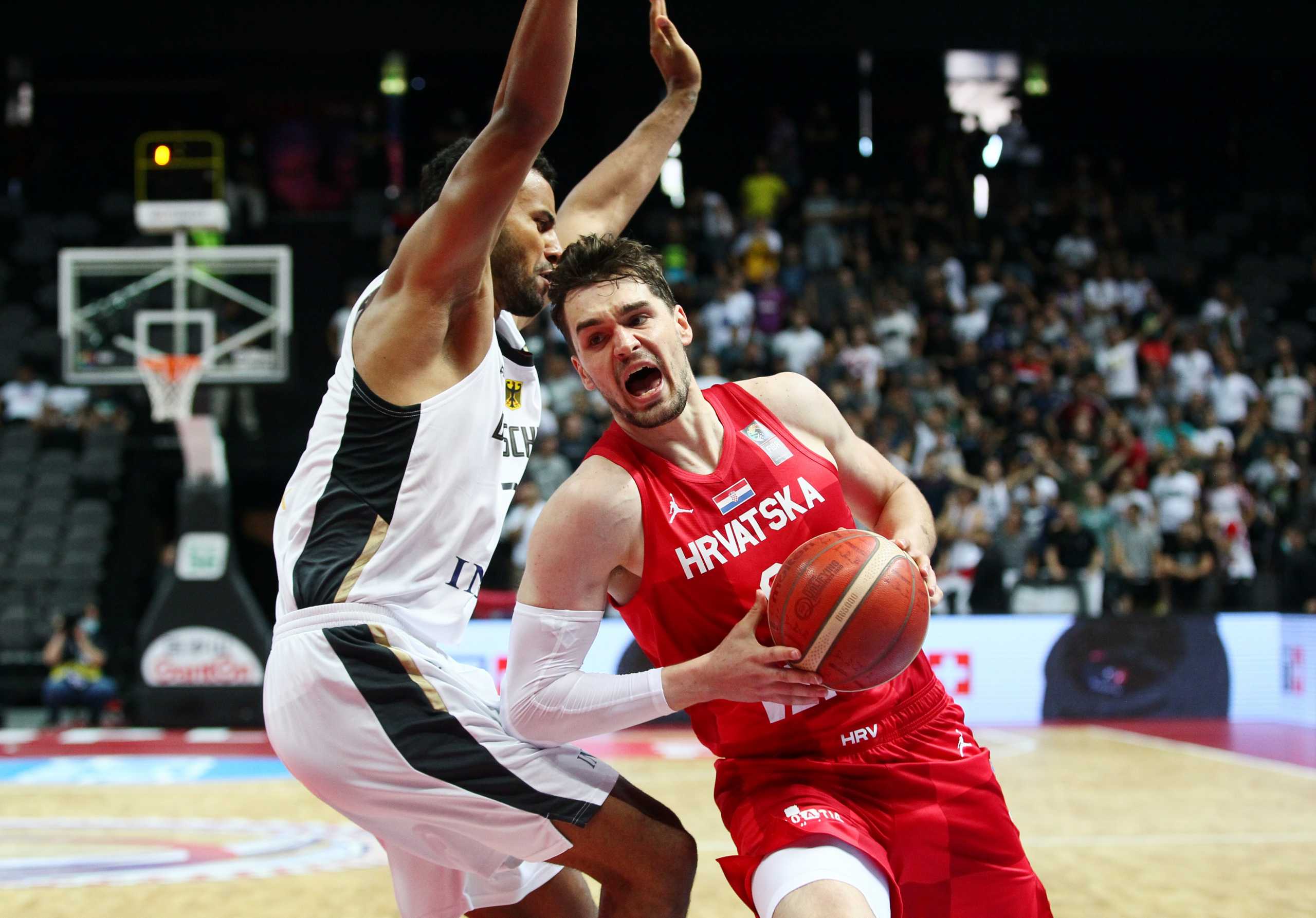 Basketball - FIBA Olympic Qualifying Tournament - Semi Final - Germany v Croatia - Spaladium Arena, Split, Croatia - July 3, 2021 Croatia's Mario Hezonjain action with Germany's Johannes Thiemann REUTERS