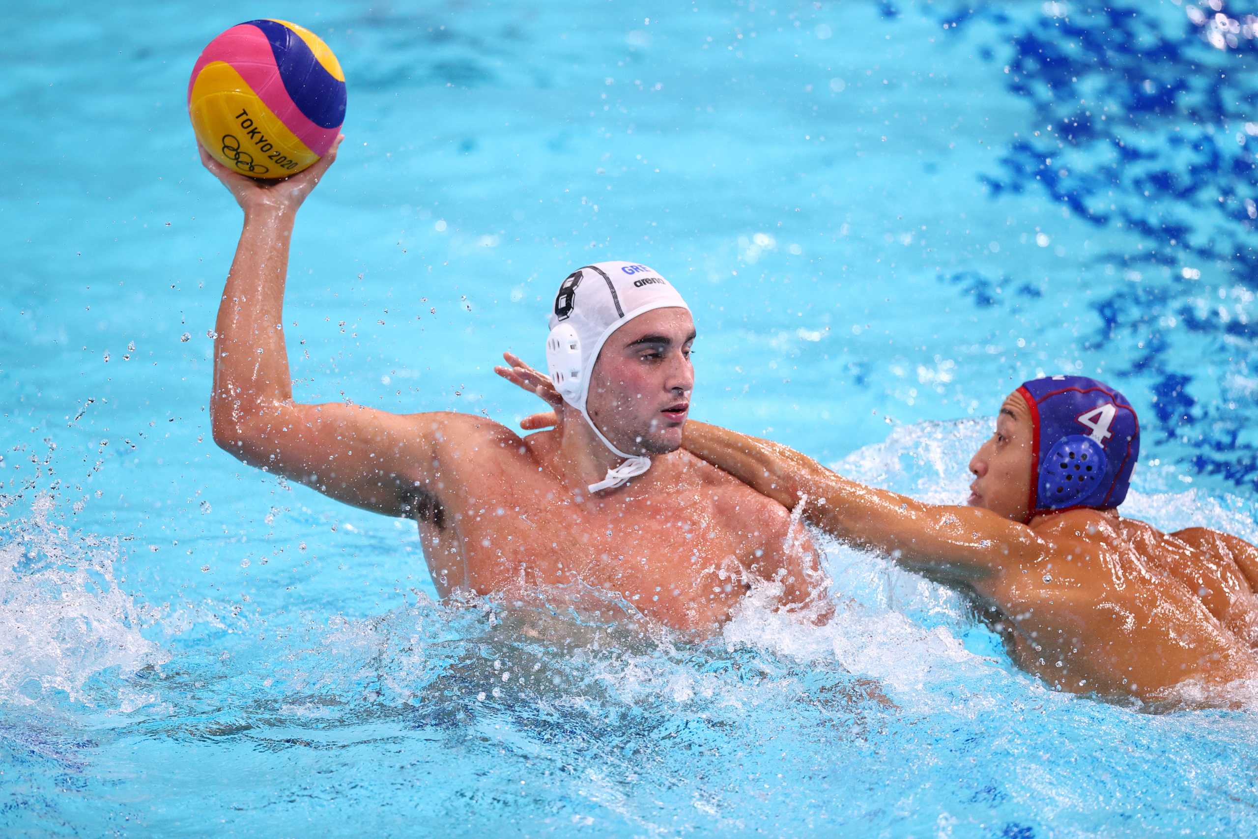 Tokyo 2020 Olympics - Water Polo - Men - Group A - Greece v Japan -  Tatsumi Water Polo Centre, Tokyo, Japan – July 29, 2021. Stylianos Argyropoulos Kanakakis of Greece in action against Mitsuaki Shiga of Japan. REUTERS